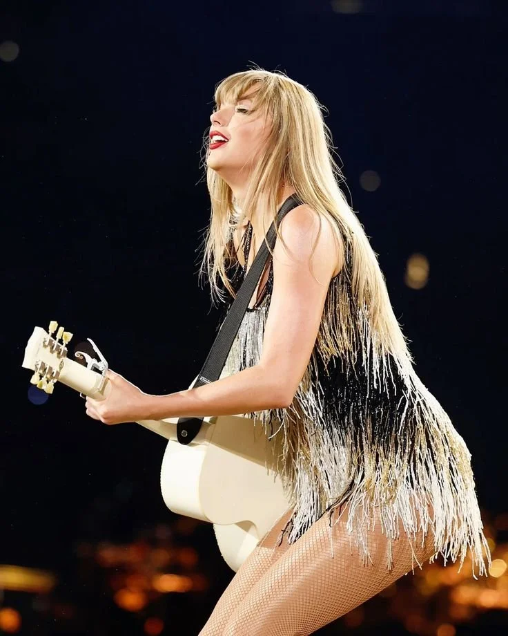 taylor PLAYING GUITAR.jpg