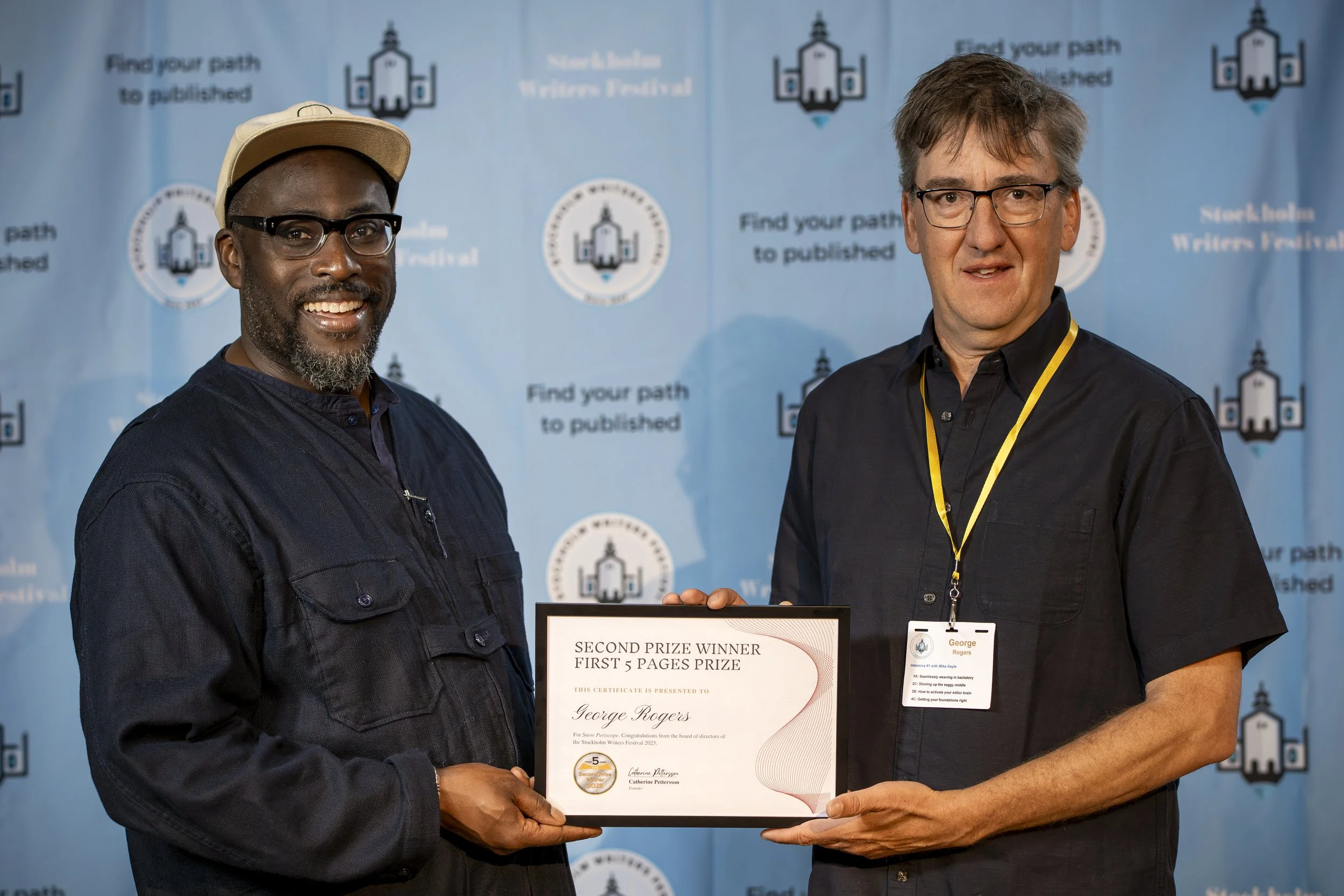 Mike Gayle awarding George Rogers the Silver Award at SWF2025