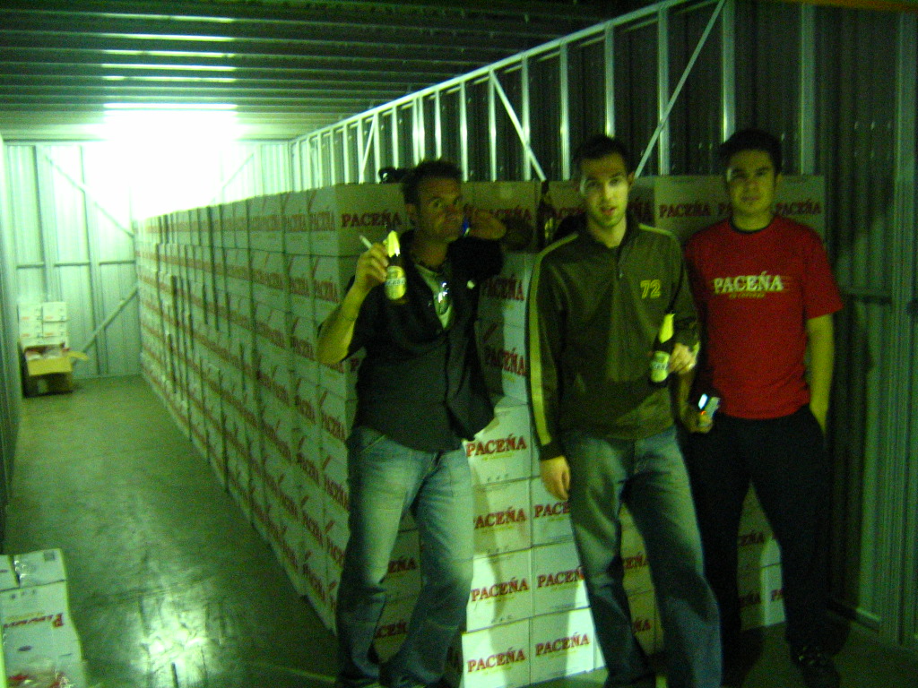 Photo of Dave (middle) and me (right) and a container of Pacena