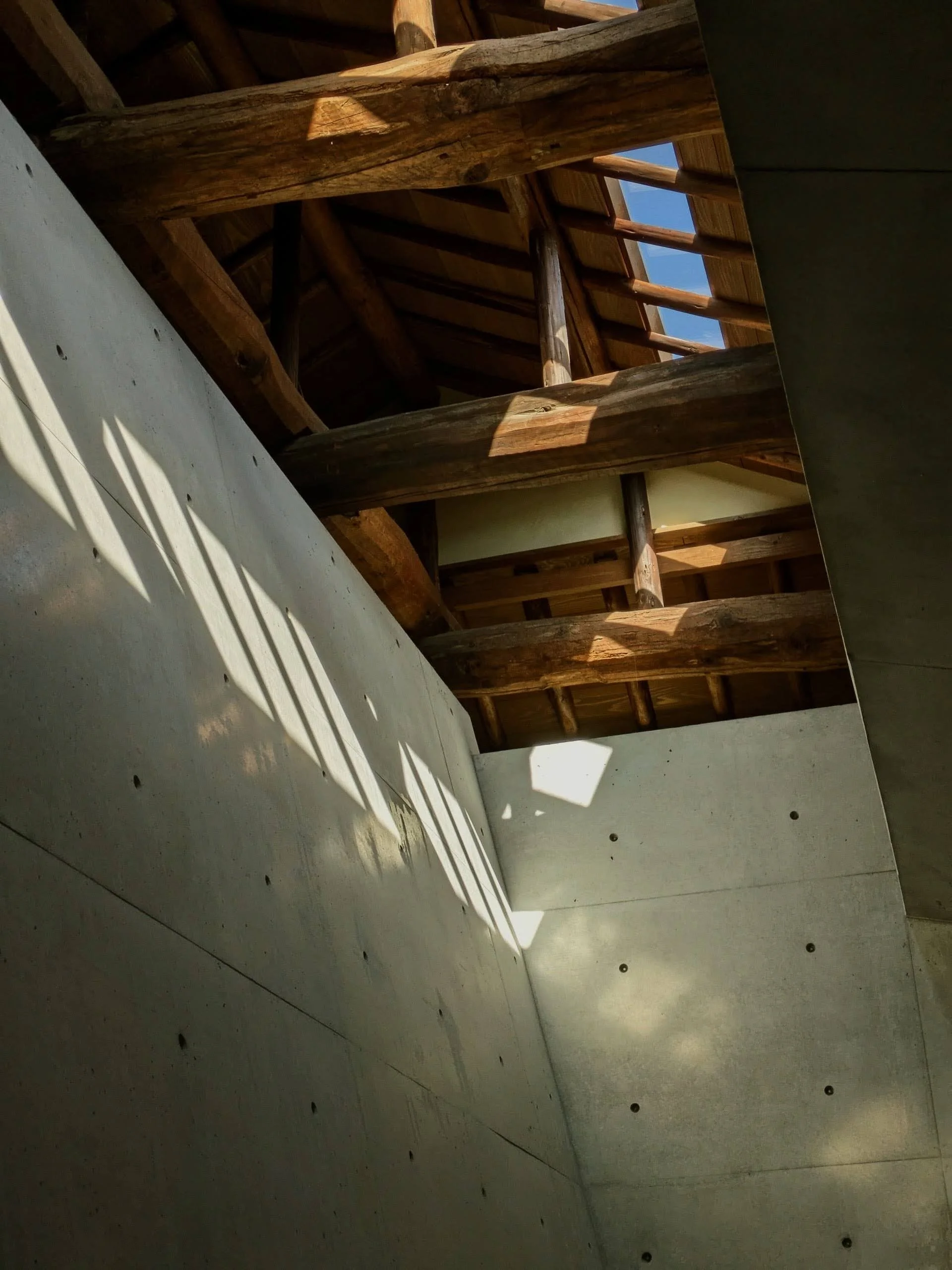 Tadao Ando Museum a study in monumental yet human-scaled concrete that informs Polysmiths' material approach to high-end house renovation, listed building refurbishment, and bespoke interiors across London.