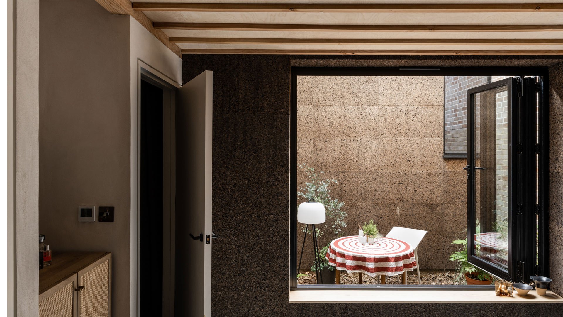 Cork House detail showing carbon-negative cork insulation and sustainable construction by Polysmiths, self-build R&D project