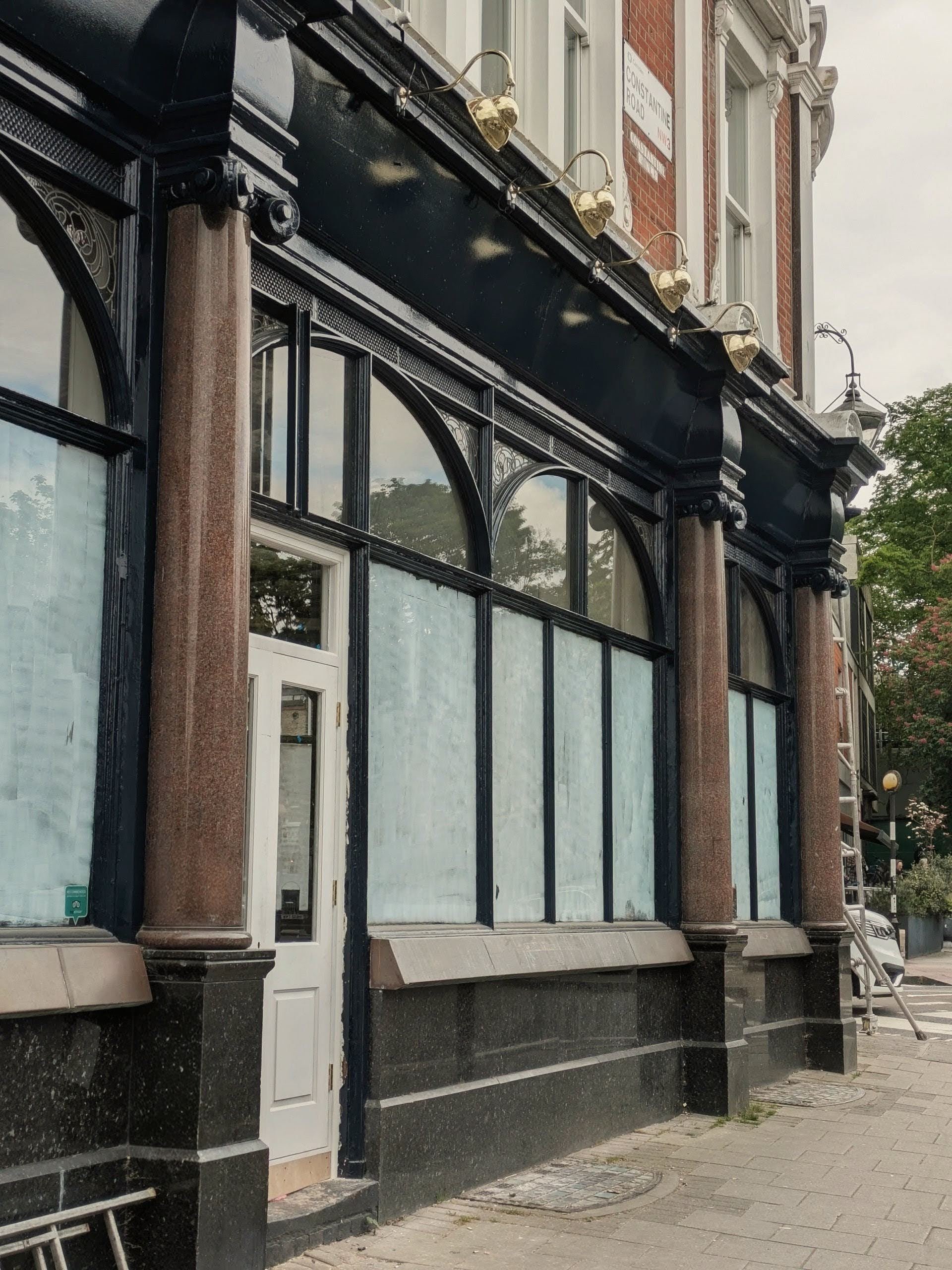 Heritage pub facade refurbishment near Hampstead Heath — grand stucco corner building, Camden Conservation Area planning consent secured by Polysmiths, London hospitality architects
