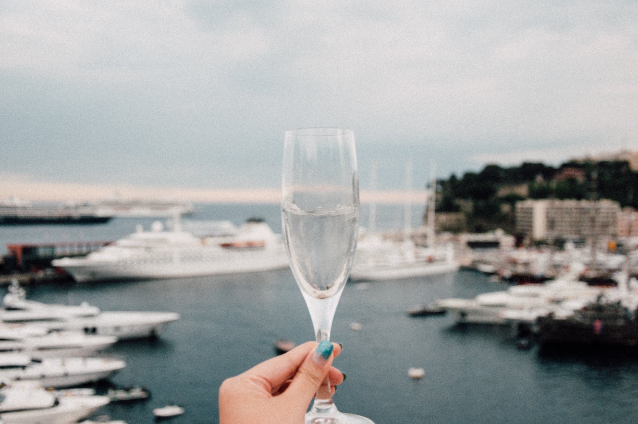 Champagne Glass and Yachts by Jennie Ramida on Unsplash