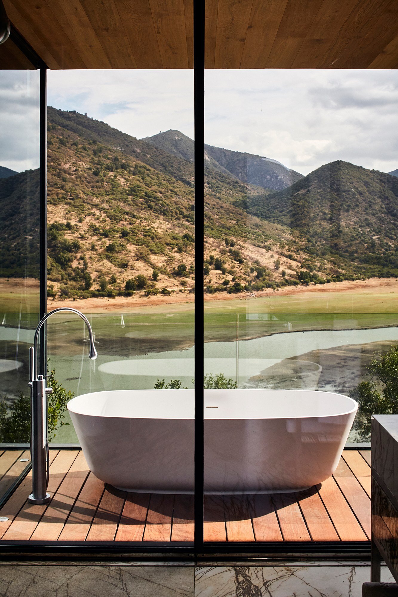 Outdoor Bathtub in each suite at Puro Vik Retreat in Chile - Glass-walled houses on cliffs overlooking the Millahue Valley