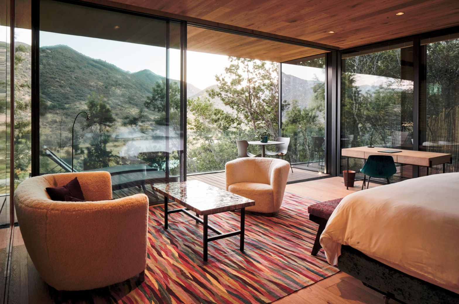 Antiquity Suite at Puro Vik Retreat in Chile - Glass-walled houses on cliffs overlooking the Millahue Valley