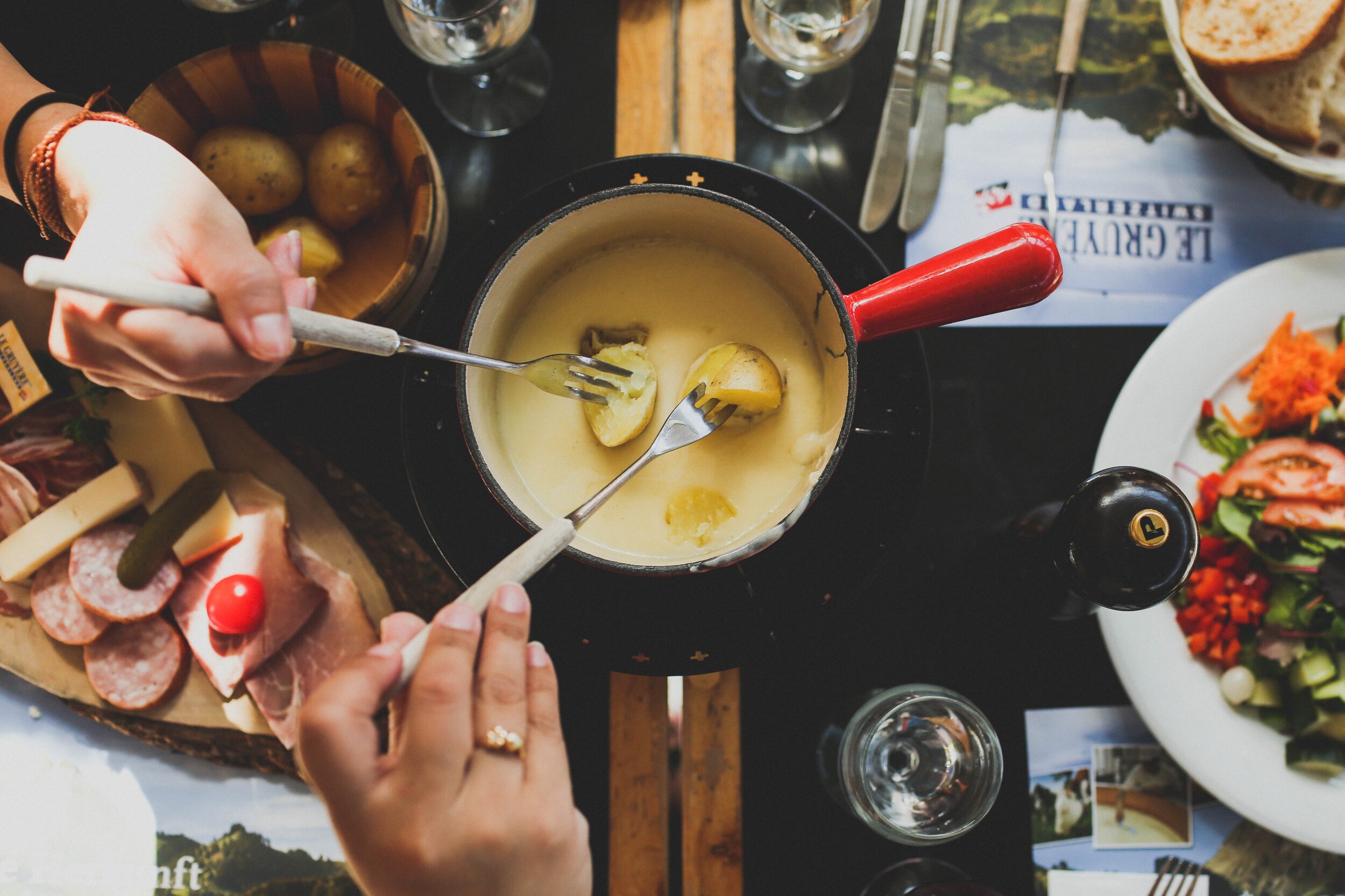 Lulu of 10K Dollar Day enjoys cheese fondue on the Zurich Fondue Tram