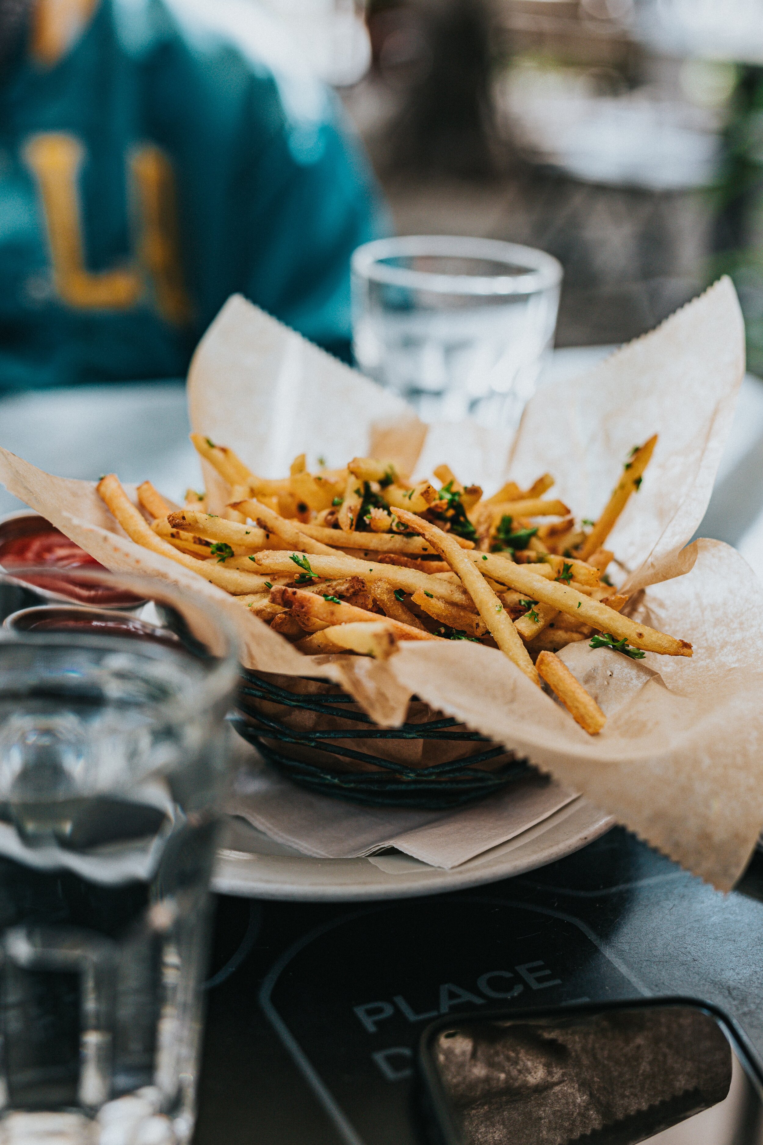 Lulu of 10K Dollar Day downs some fries before a beer drinking challenge in Bloomington, Indiana