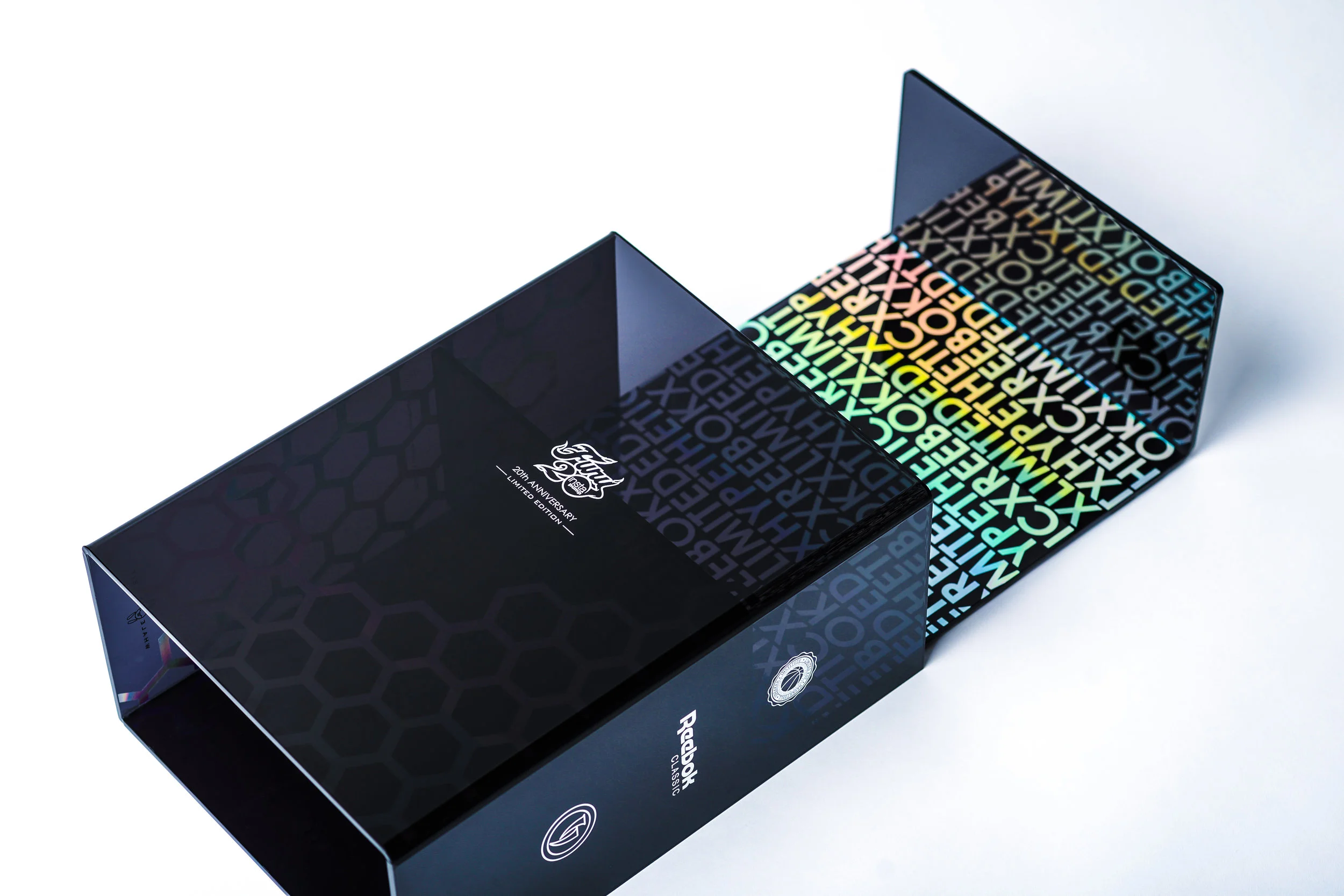 REEBOK x LIMITED EDT x HYPETHETIC 20th Anniversary - Collector's Edition. Limited to 175 Worldwide Encased in polished translucent black Lexan, accented with holo-graphics. Complete with magnetic lock and nickel-plated logos bearing statement to the edition. Art direction / product development