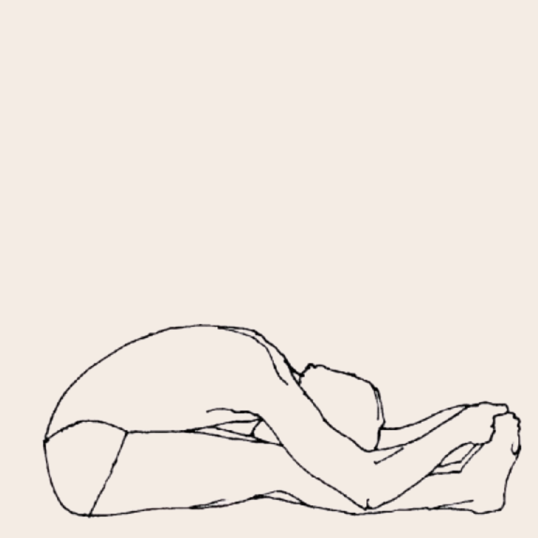 A yoga student in pascimottanasana