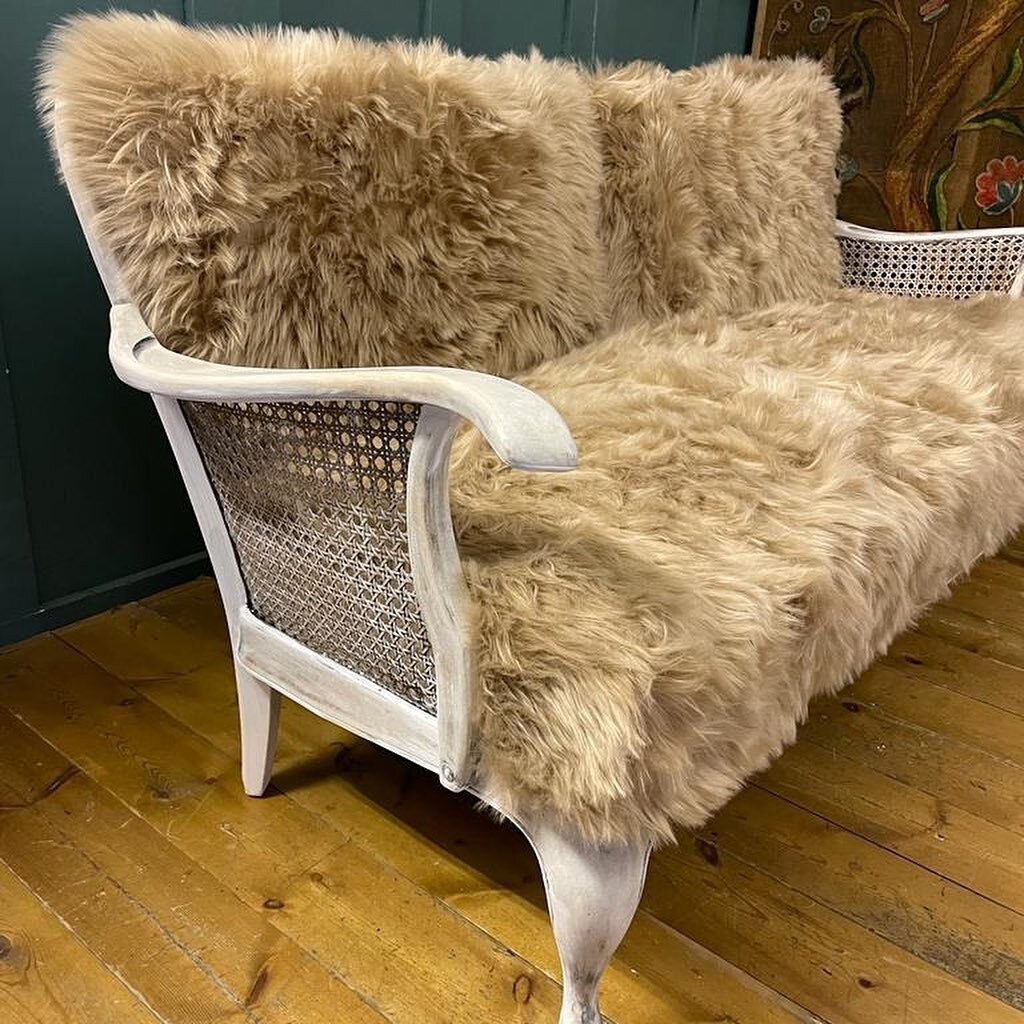 Unique Sheepskin Bergere Sofa. One off custom made piece upholstered in Artic longhair sheepskin. Sand in colour, super soft to touch. Each sheepskin sewn on our beautiful Allbrook &amp; Hashfield sewing machine to create covers. Seat has traditional
