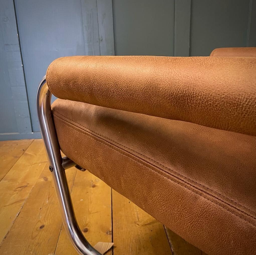 Beautiful 70s low slung tubular sling back armchair. Reupholstered in Linwood aged vegan leather. Vintage texture, supple feel freshly stuffed with tailored arms and top stitch detail. Expertly revived for a Dulwich client. 
&bull;
&bull;
&bull; 
#up
