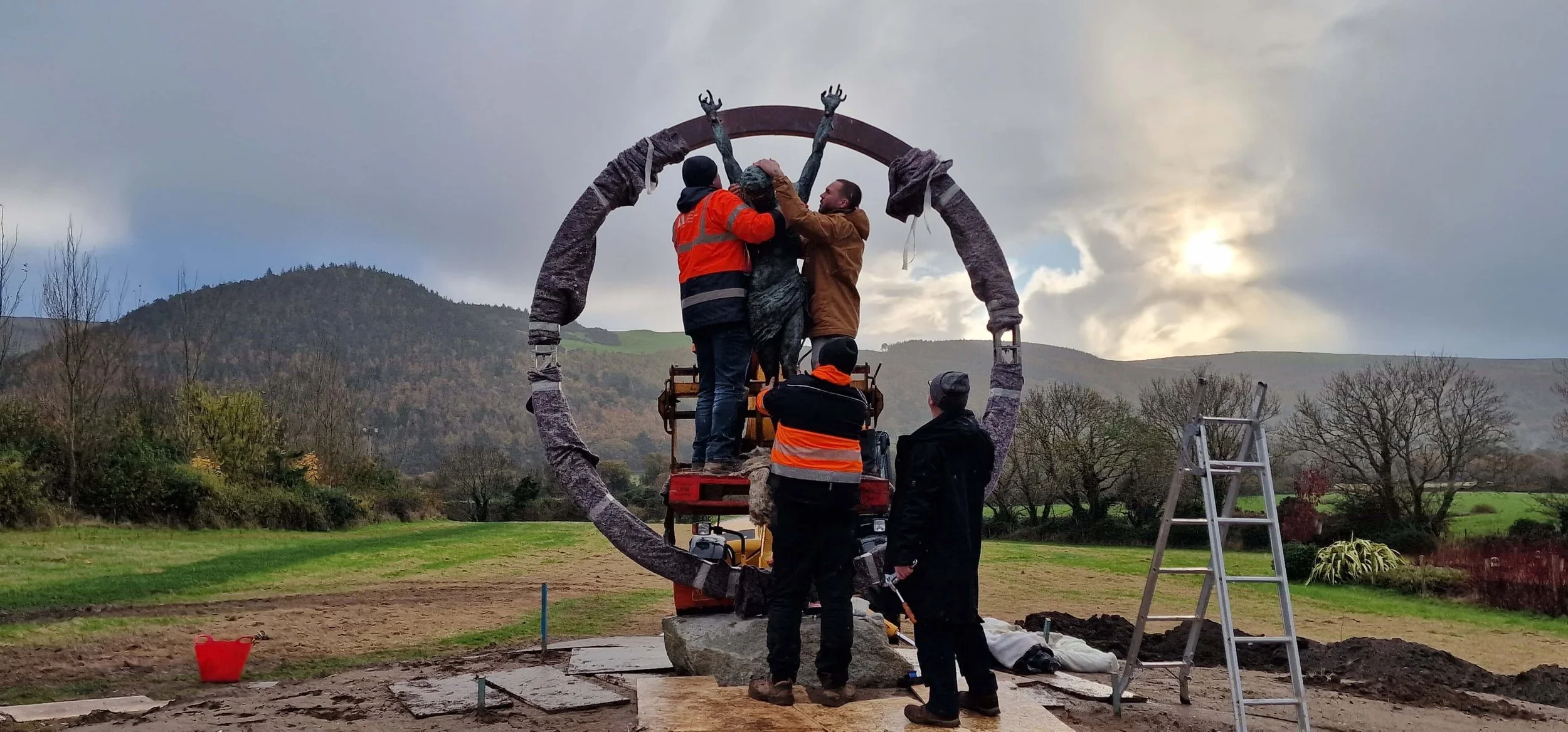  Photo of me and the team getting the bronze christ figure in to position.   Sacrifice  is a monumental public art installation commissioned for a business on the Isle of Man. Standing at 3 meters tall, the sculpture features a life-sized bronze Chri