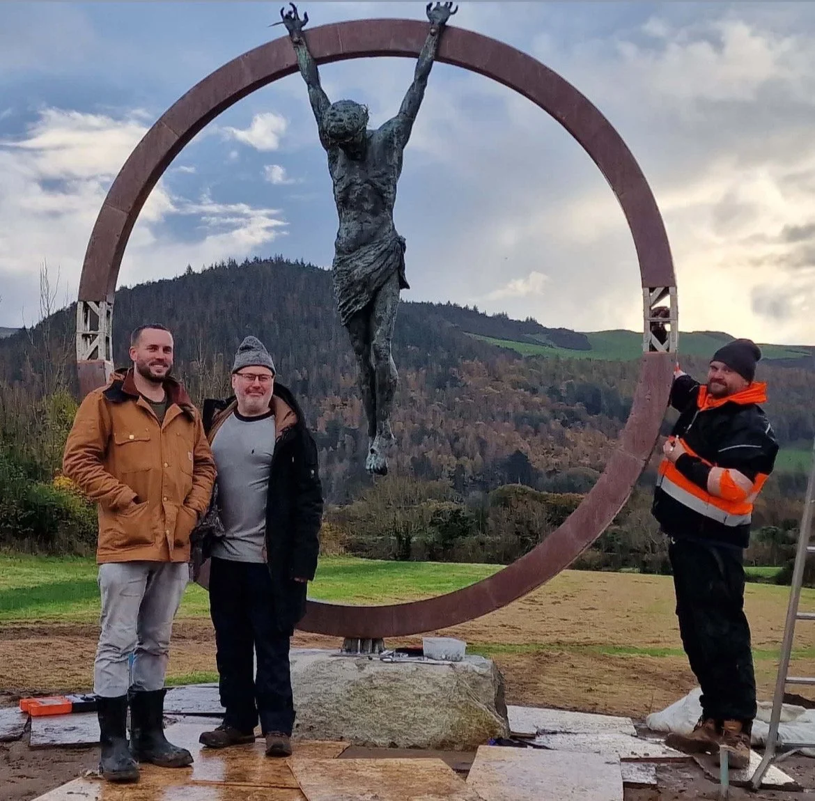 James Sutton instaling a monumental bronze sculpture