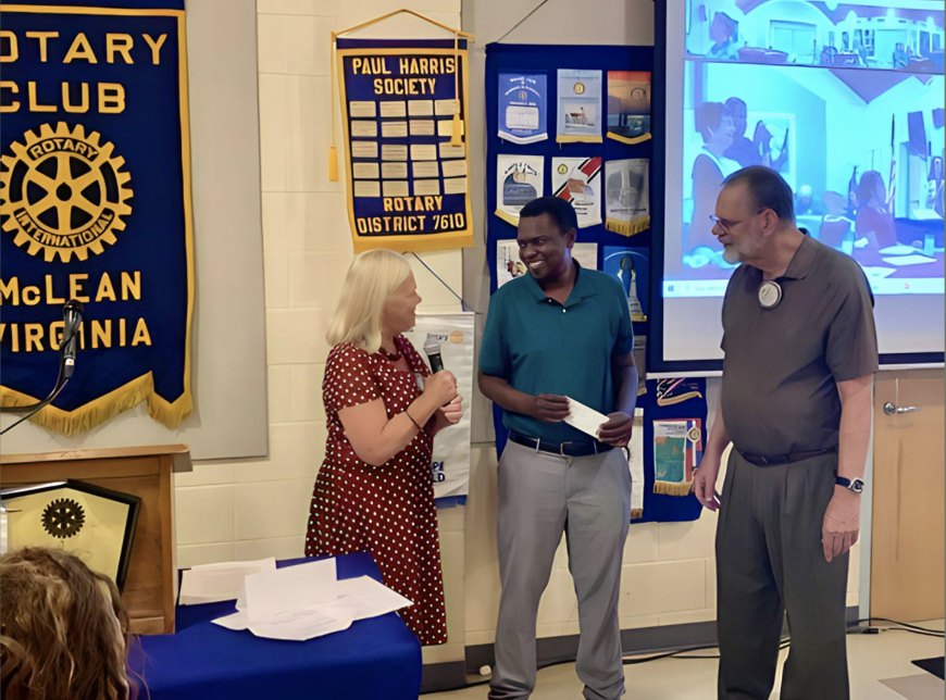 Dr. Tawainga Katsvairo (middle) with Rotary Club of McLean
