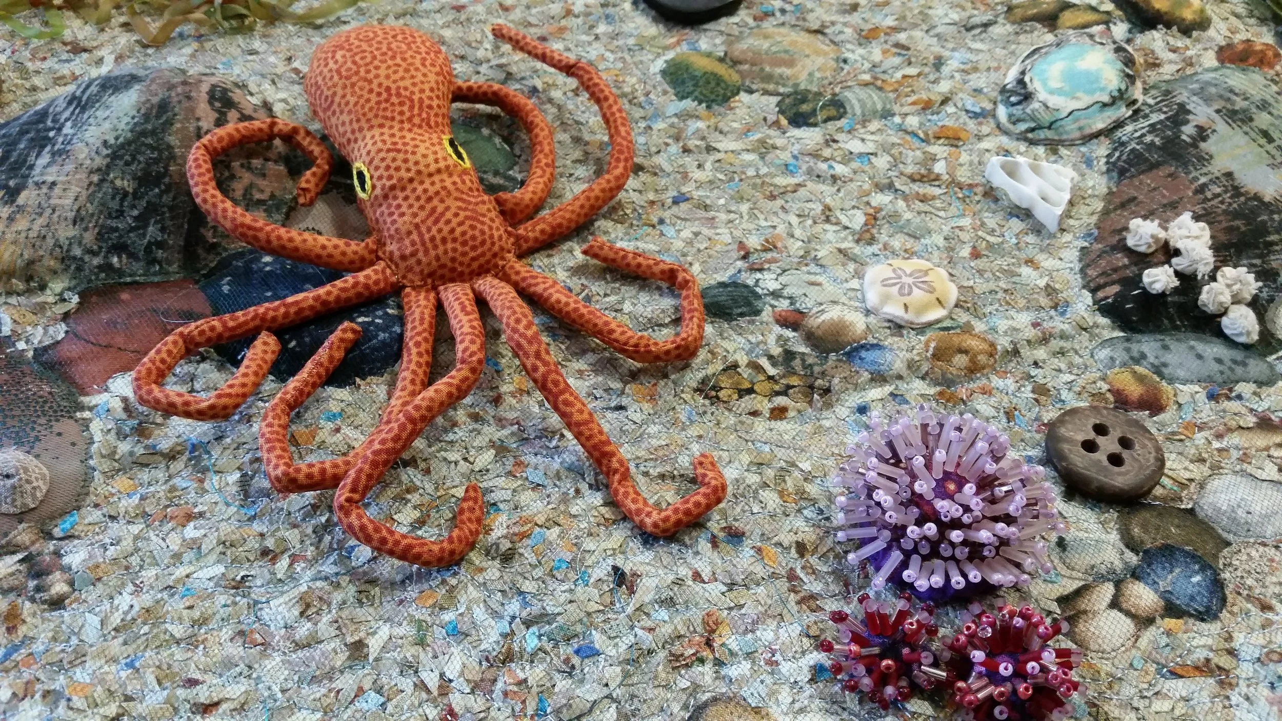 Dr. Isabel Downs, Detail of “ Tidepool Souvenirs - Littoral Memories ” | Oil, cotton, ribbons, buttons, beads, tulle, monofilament fishing line, and origami