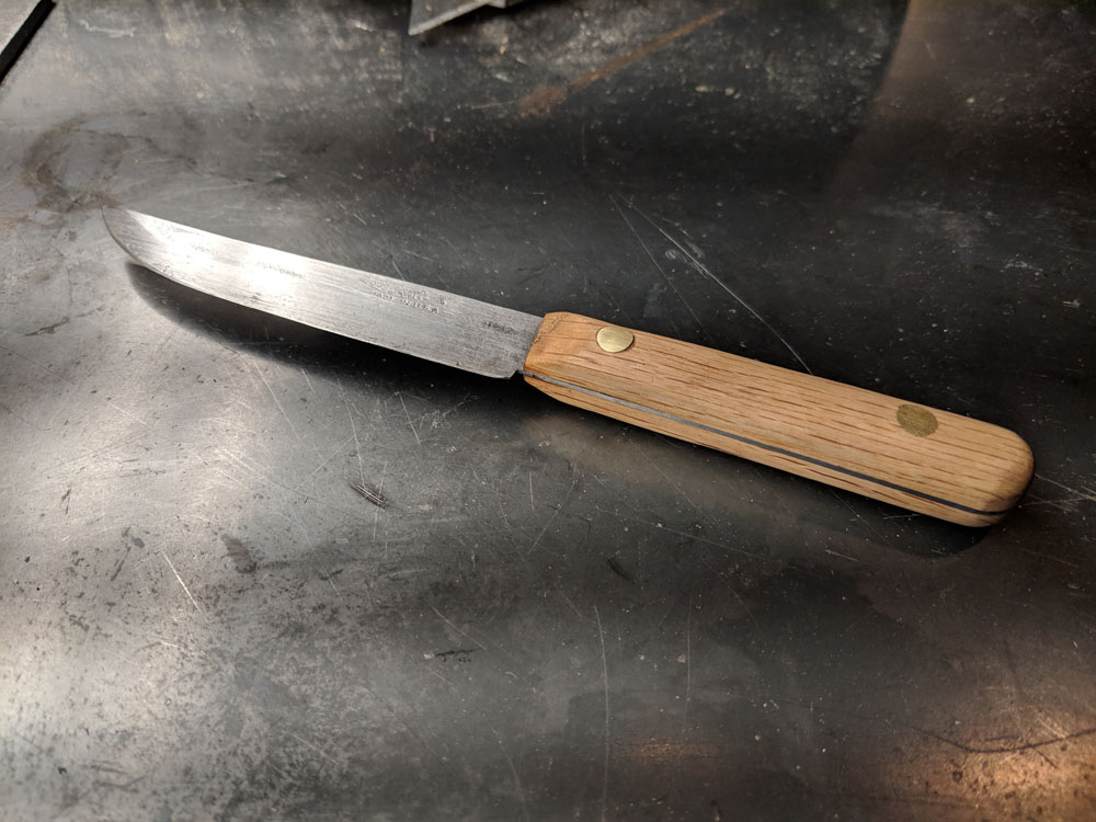  The finished product! Once it was all oiled, I sharpened the knife using a whetstone. Ready for service in the kitchen! 