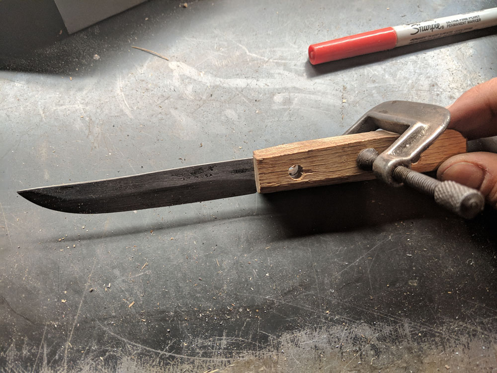  I coated both sides of the blade with epoxy, aligned the holes, then hammered the pins through. 