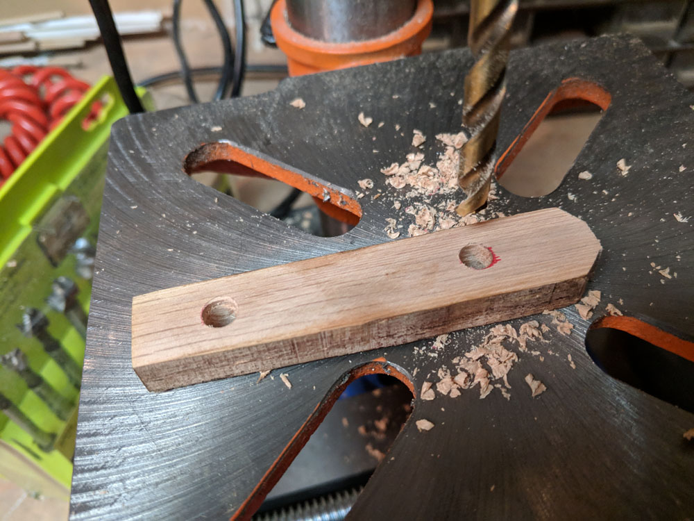  After marking the position of the holes on the tang, I drilled matching holes in the wood. 