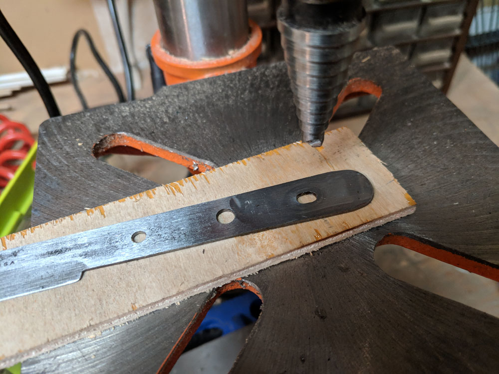  I drilled the holes using a step-drill. The single cutting edge tends to be good for drilling through thin materials. It doesn’t grab your work quite as much. 