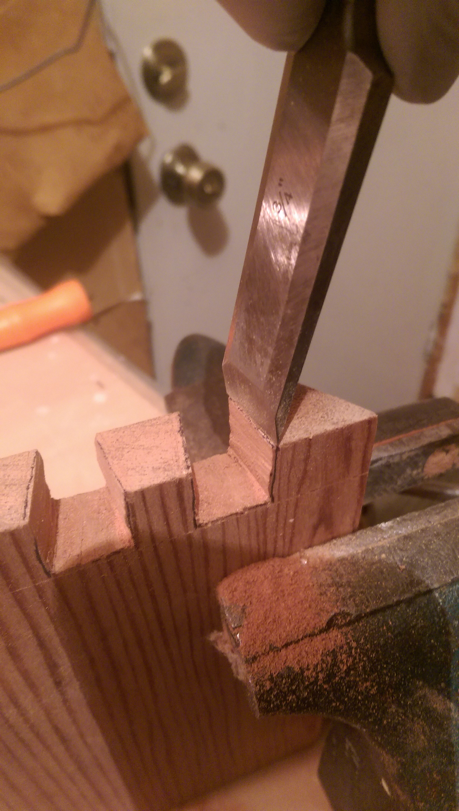  I used a chisel to clean up some of the corners with limited success. A combination of cheap, dull chisels, and the soft nature of cedar wood left something to be desired. 