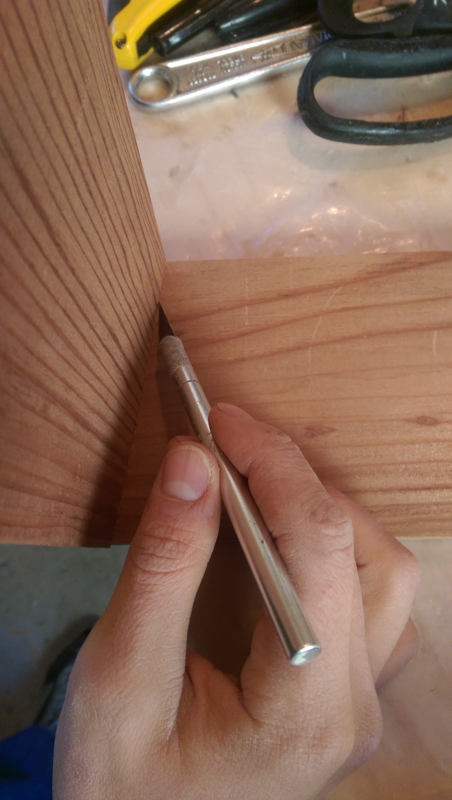  I used a hobby knife to score a line to accurately mark the thickness of the wood. This will give me a depth to cut the dovetails. What I learned later is that I should have cut the dovetails slightly deeper than this line. 