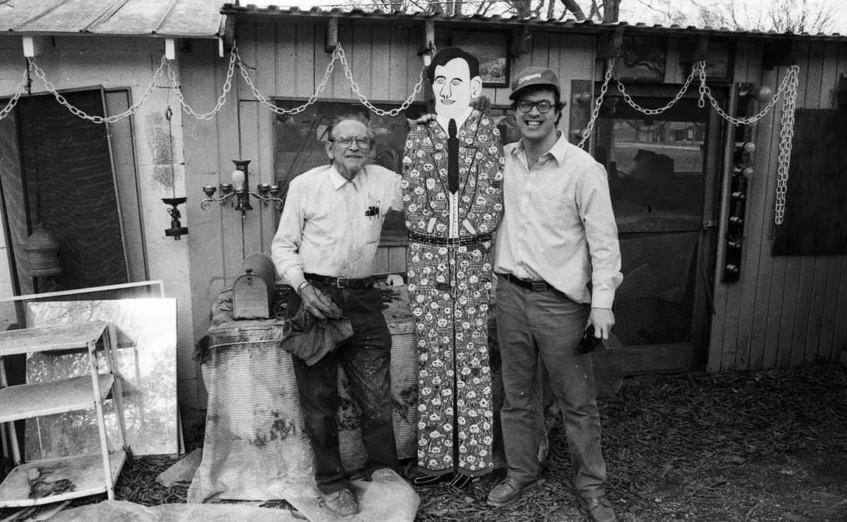 Gene with Howard Finster. One day Kevin Sartain was photographing Howard Finster (1916 – 2001, a Georgia artist and Baptist minister whose folk art sculpture garden had some 46,000 pieces of art) and brought Gene along to make a day of it. Says Sartain: “What a complete blast.”