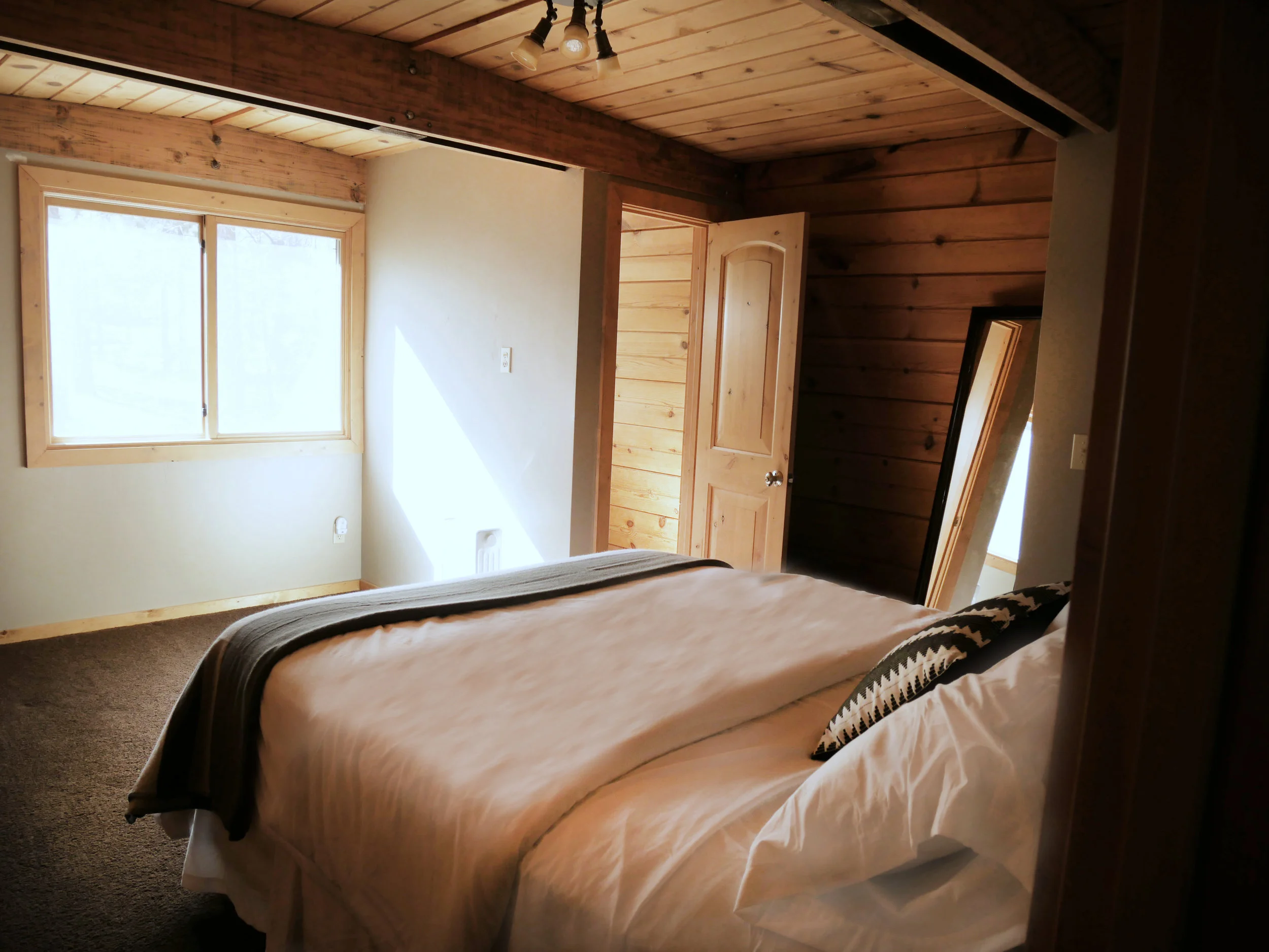  Wake up to magical forest views from the master bedroom. 