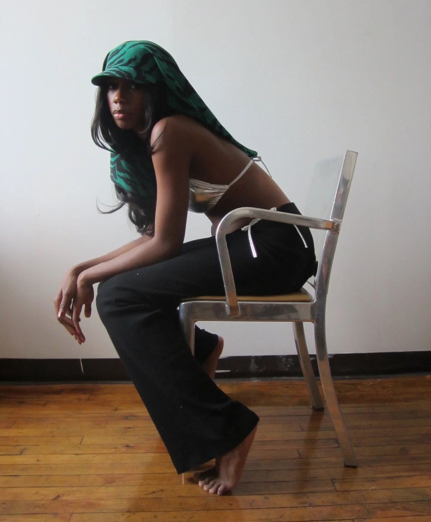 Tash in our signature EDIE hat. for spring we made 10 hats from this 1970s deadstock Italian silk in emerald and black animal stripes 🦓 only on highdivenyc.com