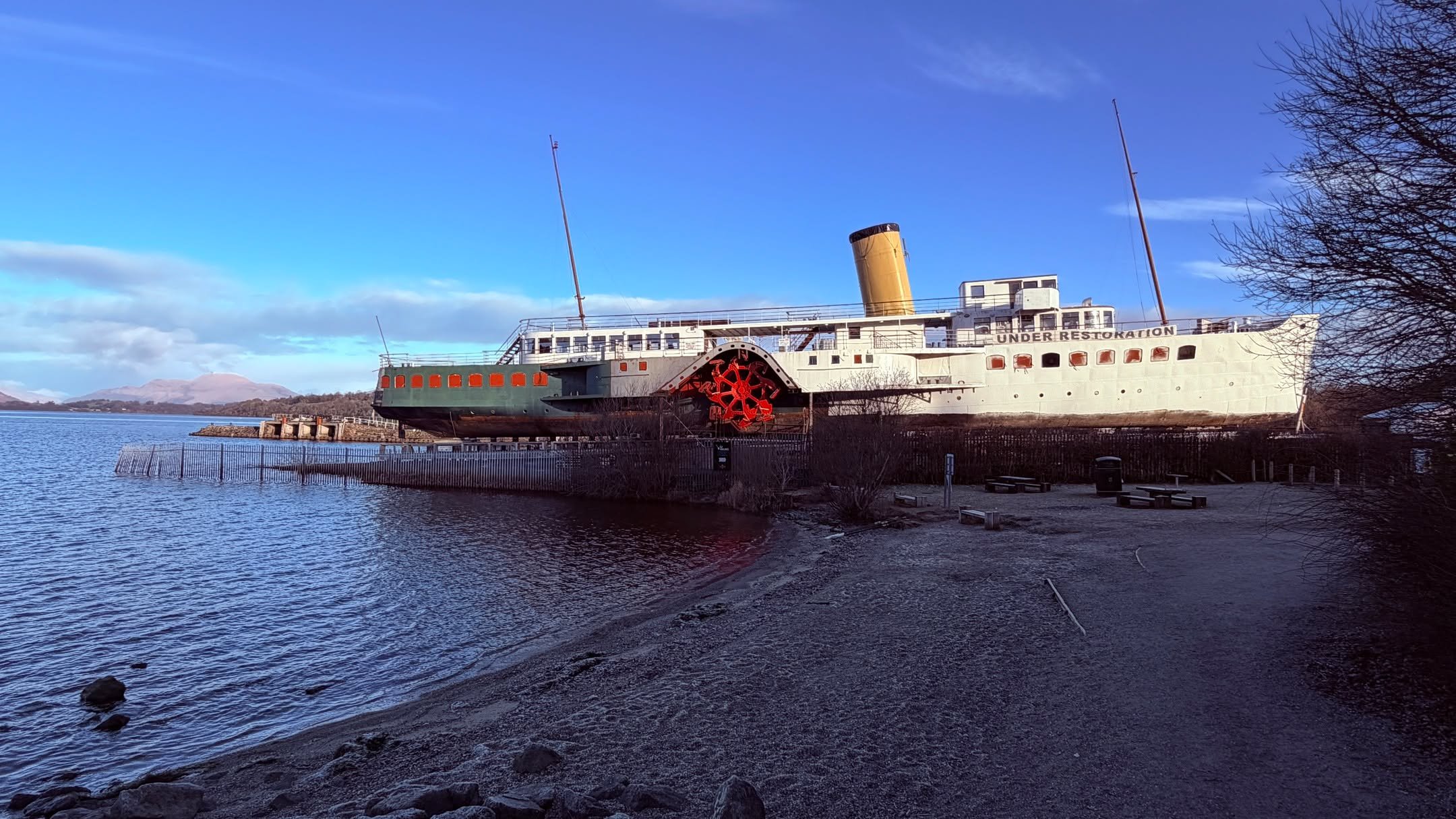 A cold but beautiful morning at @lochlomondshores this morning and a short walk to see @maidoftheloch with Ben Lomond in the distance.