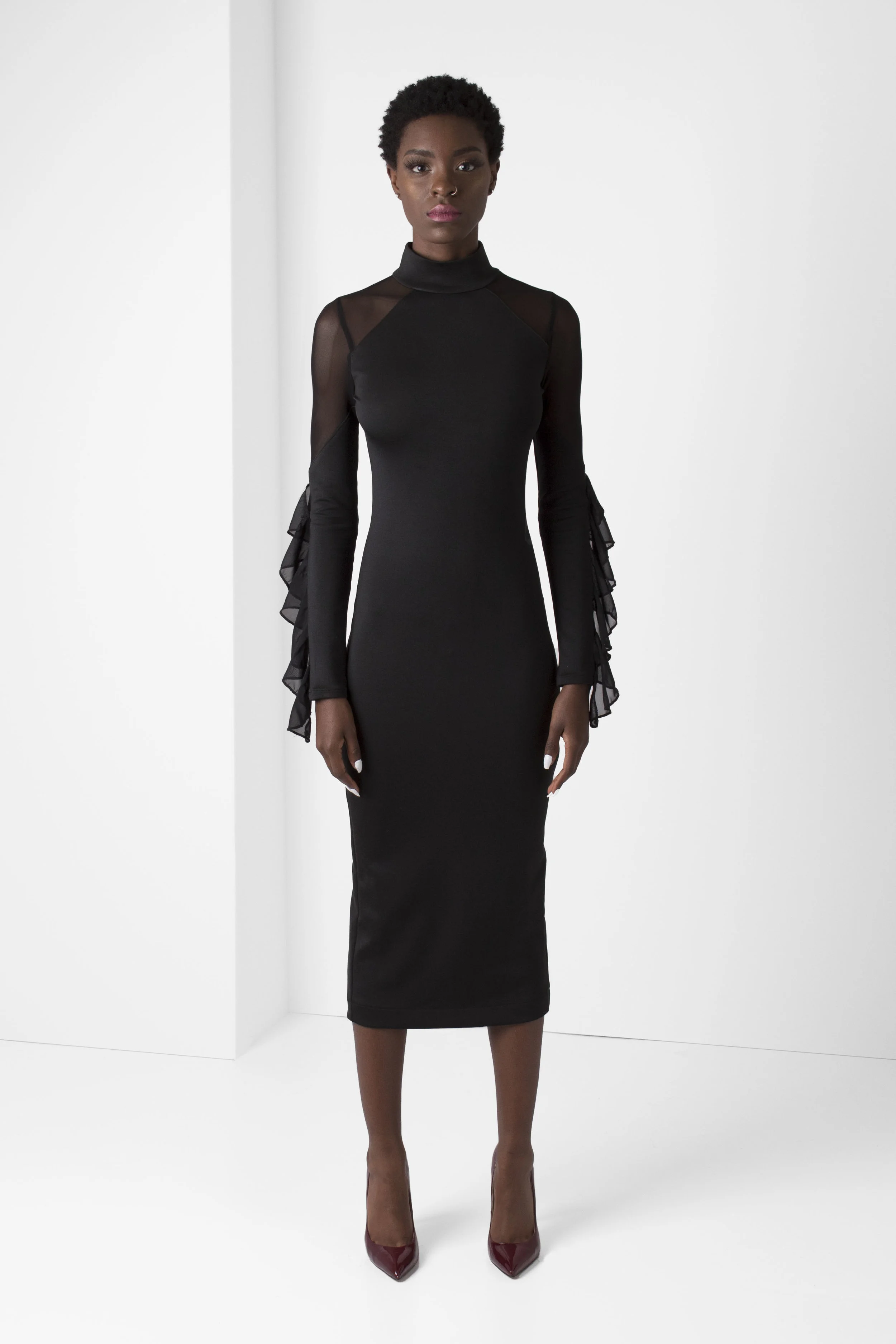 PacoRogiene_NYC_Black_Pencil_Dress_Mesh_Shoulders_Ruffle_Trim_Frontview_Ecom_2018_Colored_Expressions_Collection_V1.jpg