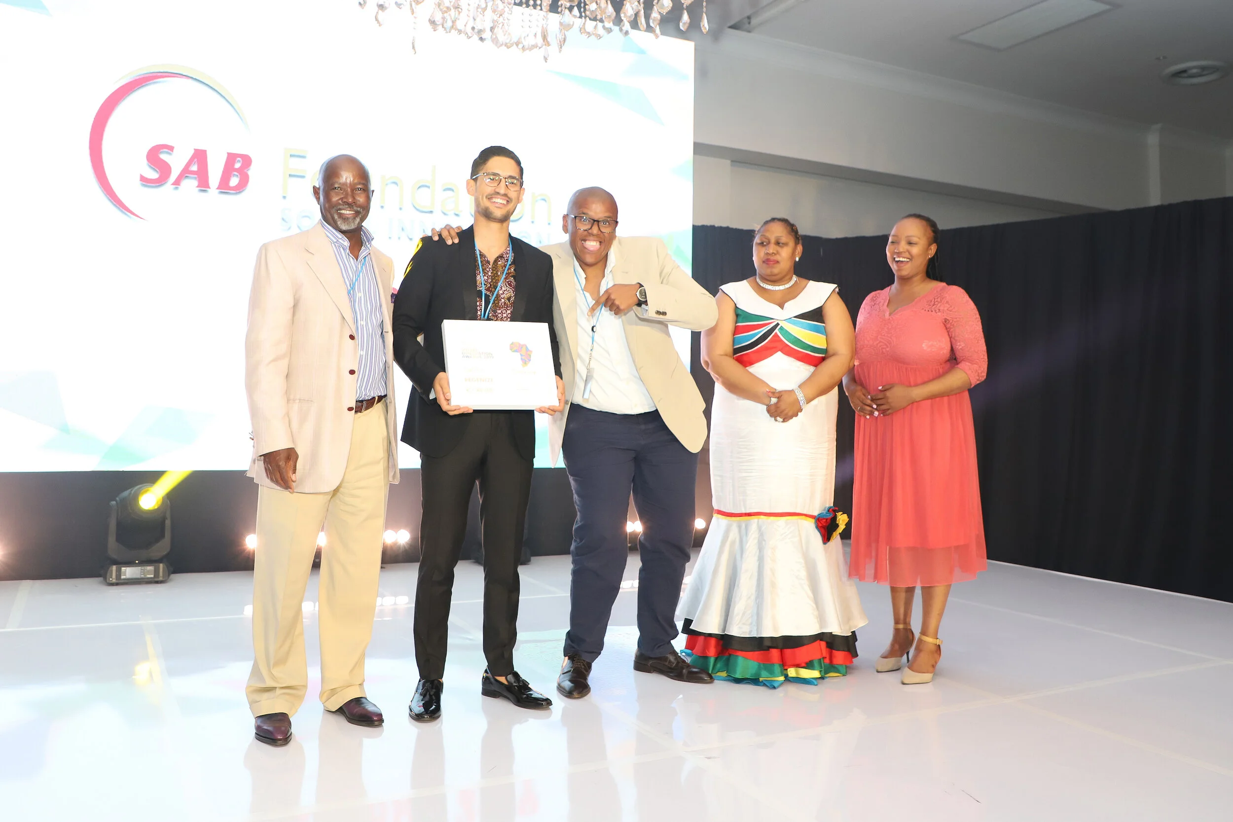Pictured (left to right): SAB Foundation Chairman and External Trustee; Moss Ngoasheng; Regenize, Social Innovation Awards winners Chad Robertson and business partner Nkazimlo Miti; Deputy Minister of Social Development, Hendrietta Bogopane-Zulu; and SAB Foundation Social Innovation Project Manager, Ntandokazi Nodada