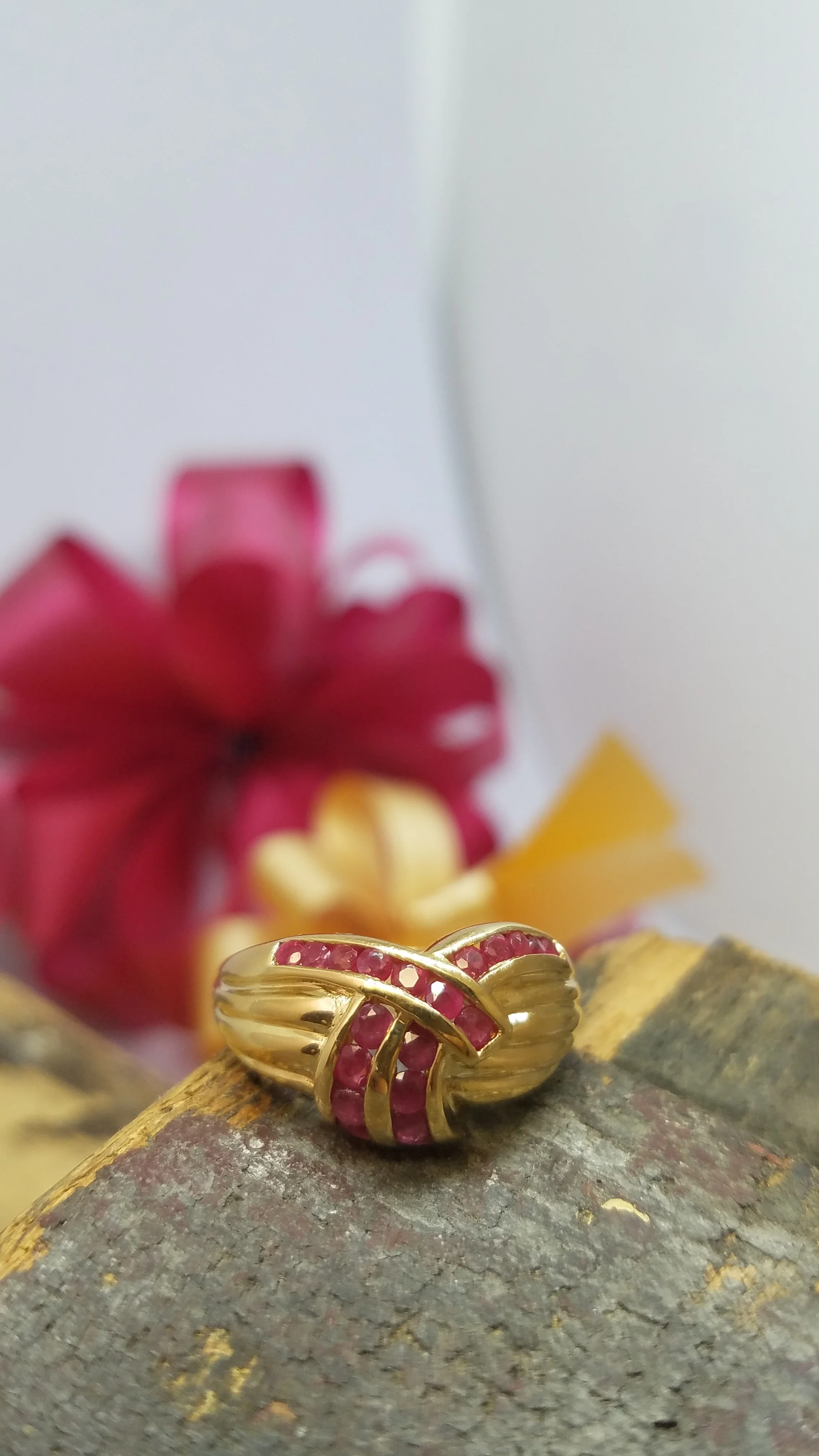 Synthetic Ruby channel set in 14K yellow gold