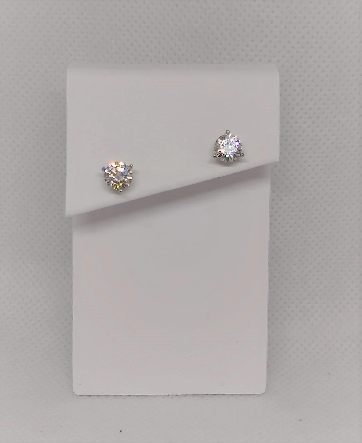 2.00 ct-tw Moissanite stud earrings set in 14K white gold.