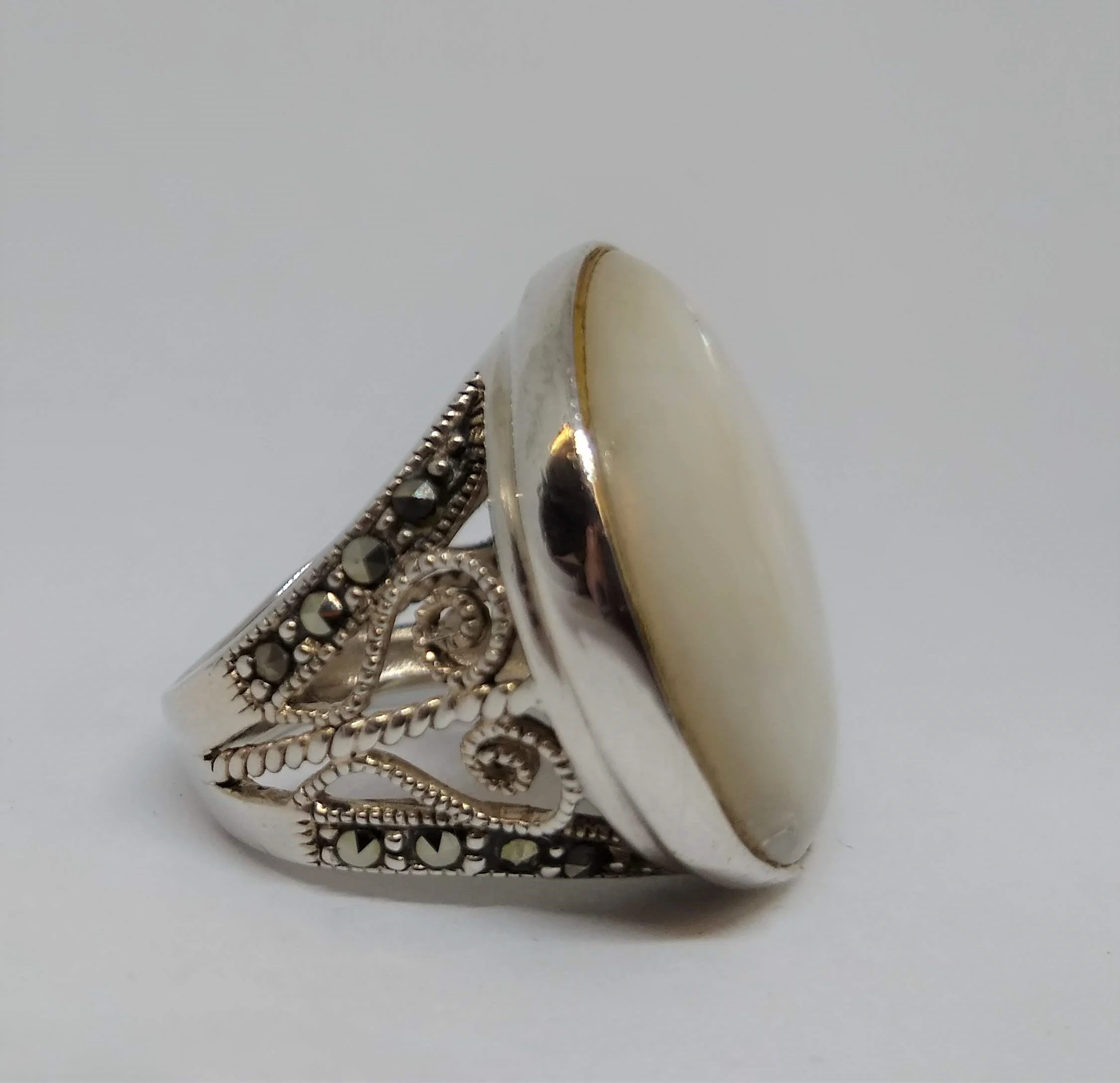 Signed NF 925 Mother of Pearl with Marqosite Stones accenting the sides.