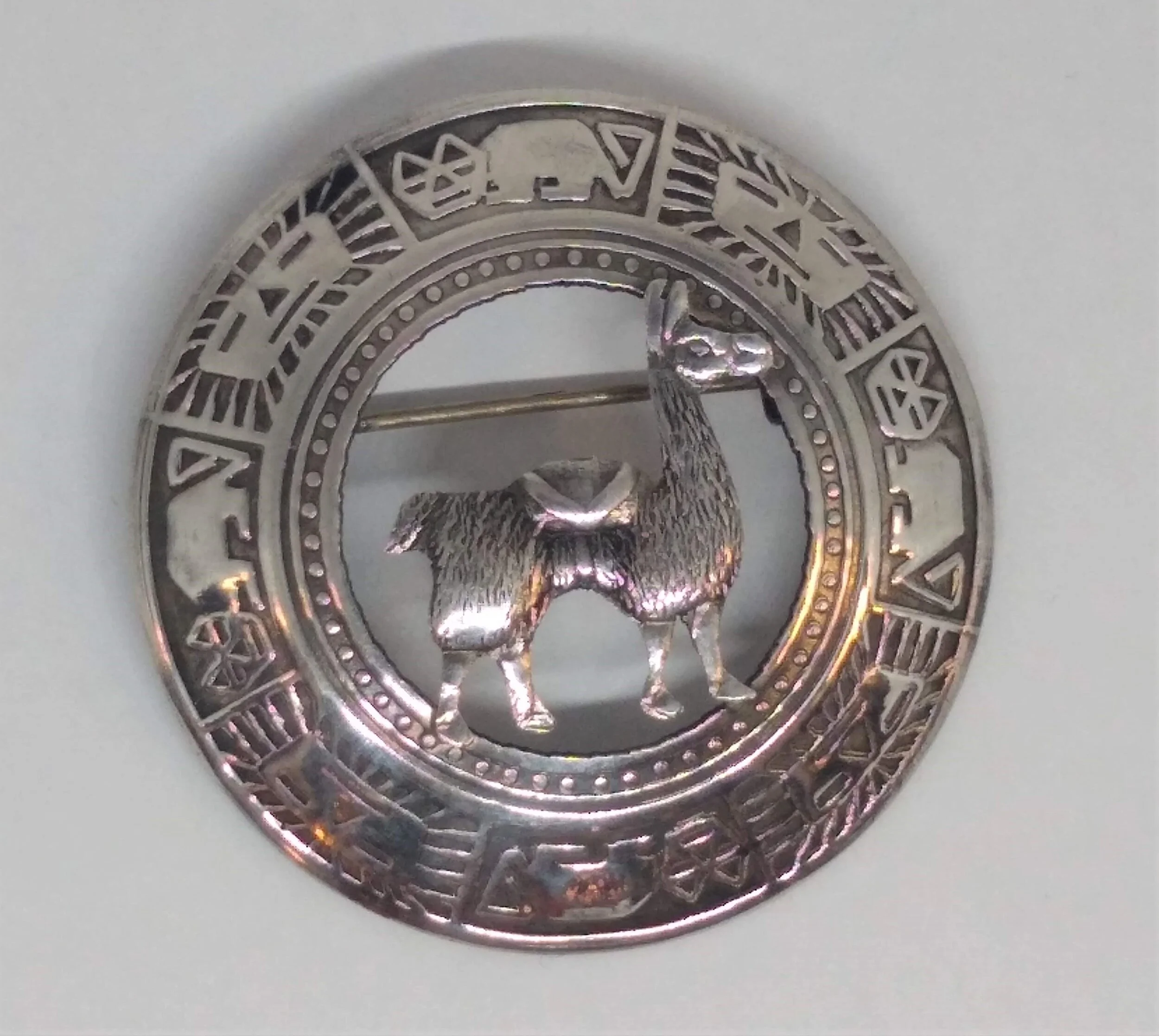 VINTAGE ,Signed, JFG PERU STERLING SILVER LLAMA AND SYMBOLS PIN.