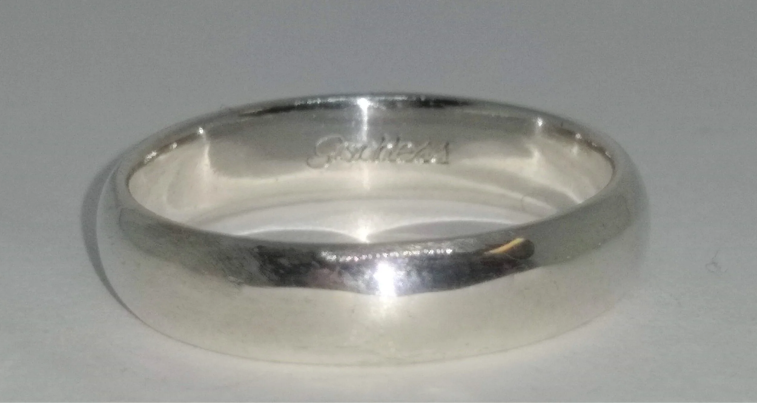 MC, 925, 4.5mm, Comfort Fit Band. Size 8.5 "Goddess " engraved inside band.