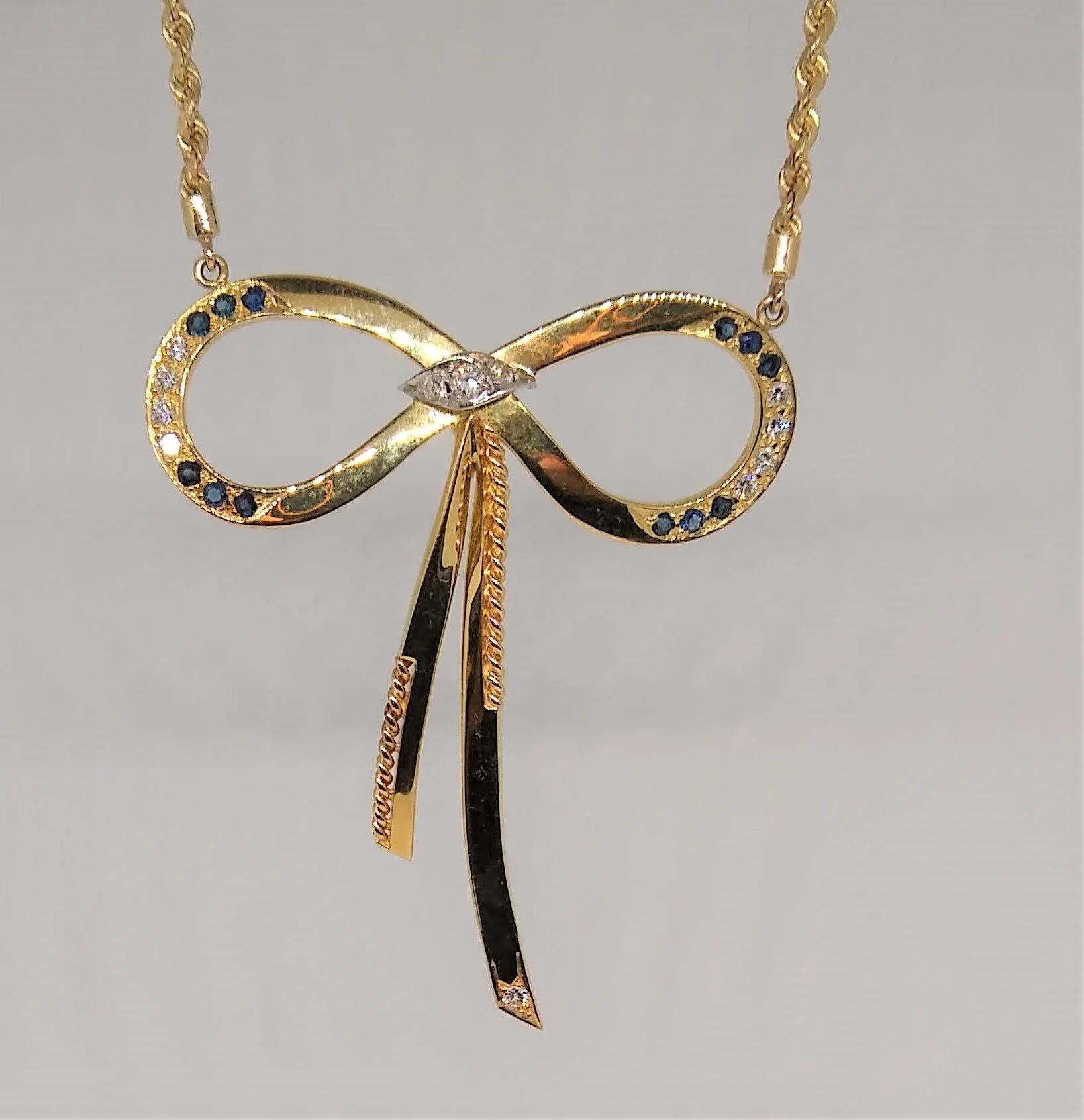 18K,Yellow Gold, Handmade, Diamond and Sapphire Bow Pendant on a 14K Split Chain