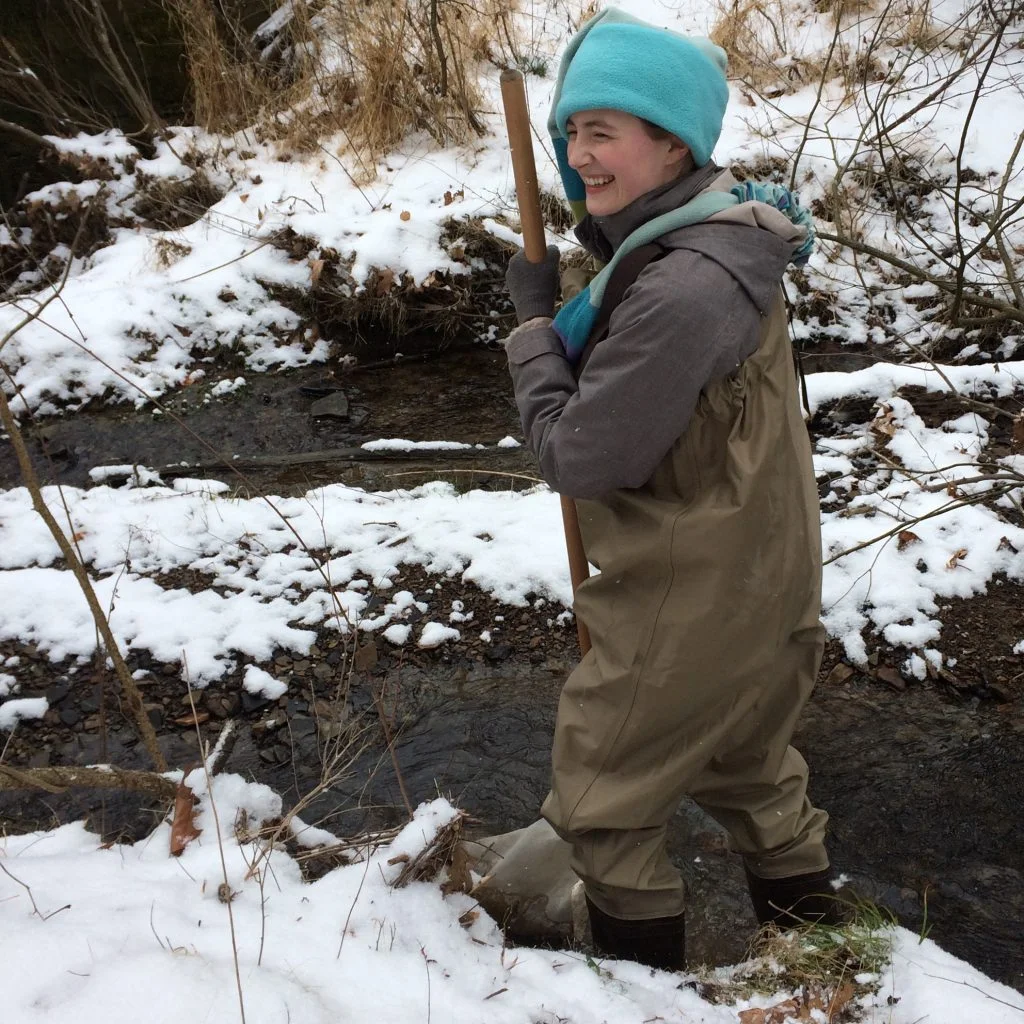 Frownfelter collects stream data for one of the qualitative ecology labs