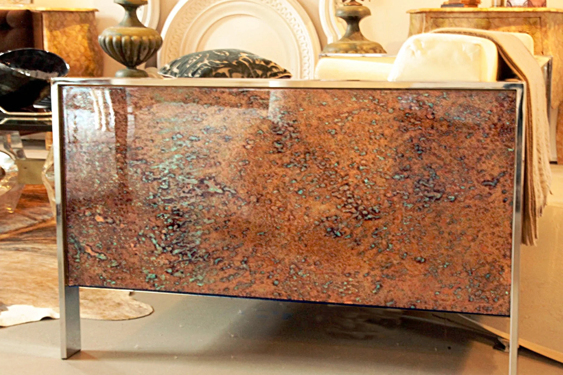 Detail of side of sofa; hand patinaed copper with bronze and turquoise colors.