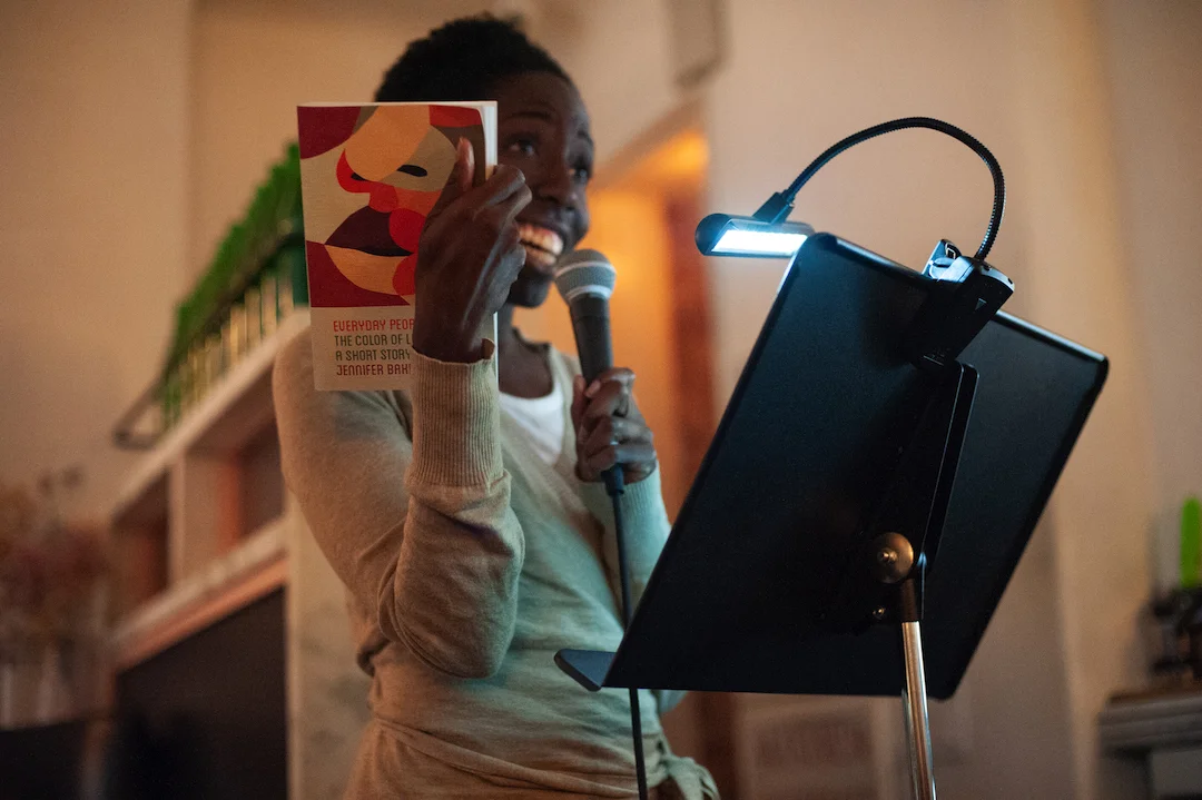 Photo of Freya Project Reader Jennifer Baker with her own book “Everyday People.” Photo by Keira Chang.
