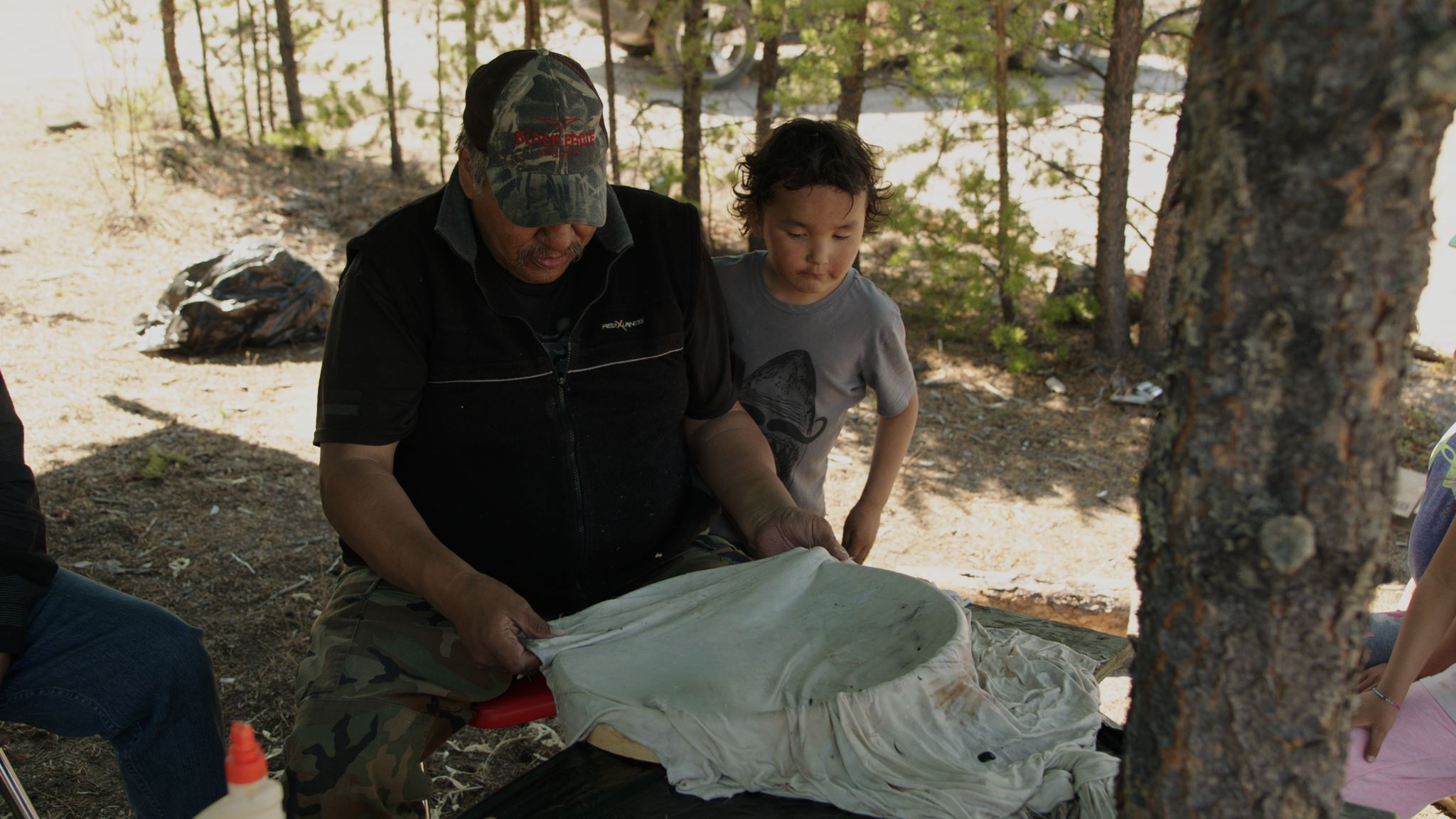  Elders from Black Lake, Saskatchewan teach the younger generation to make traditional drums out of stretched caribou hide. 