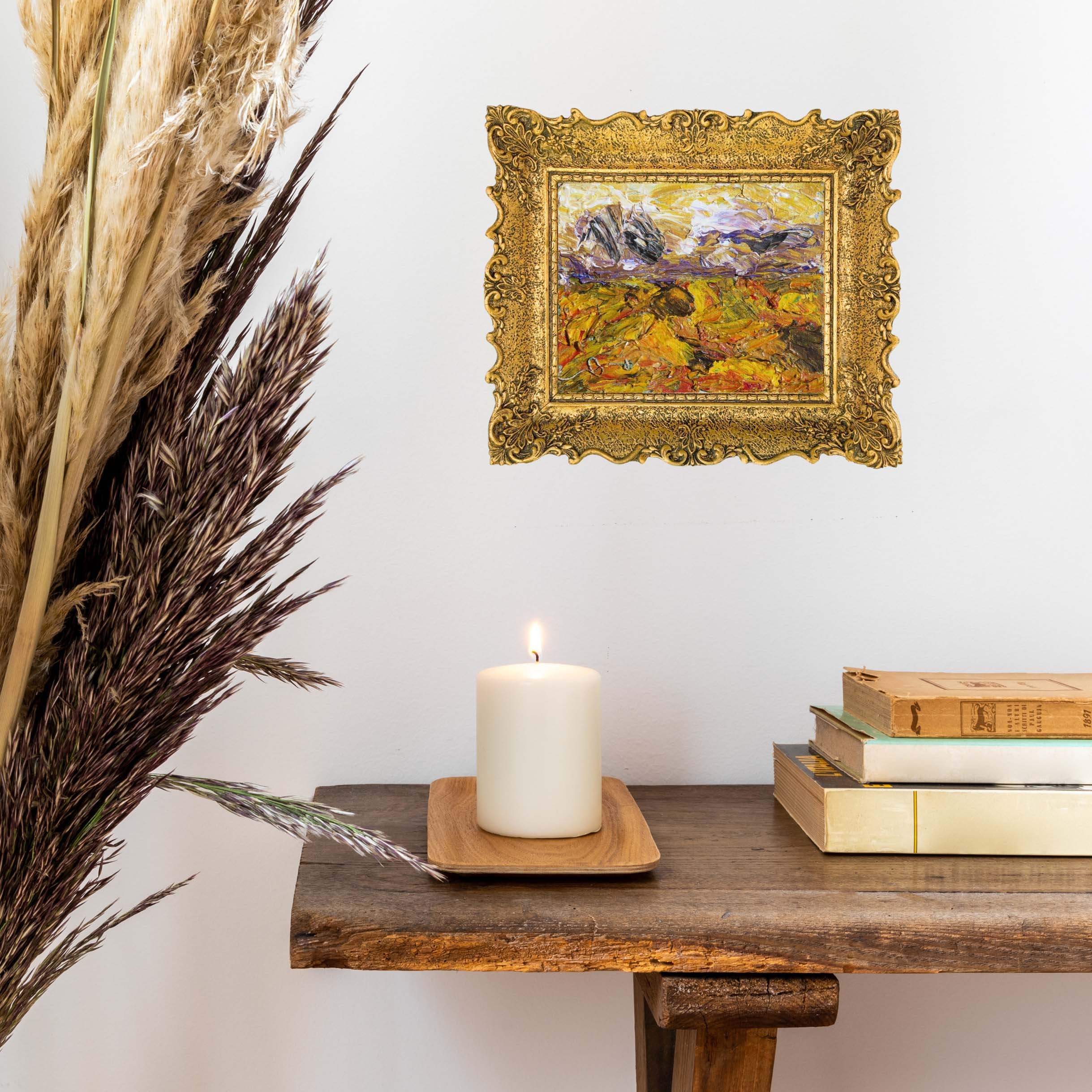 Vibrant impasto painting depicting abstract fall landscape with golden yellows, oranges and deep purples in a decorative gold frame.