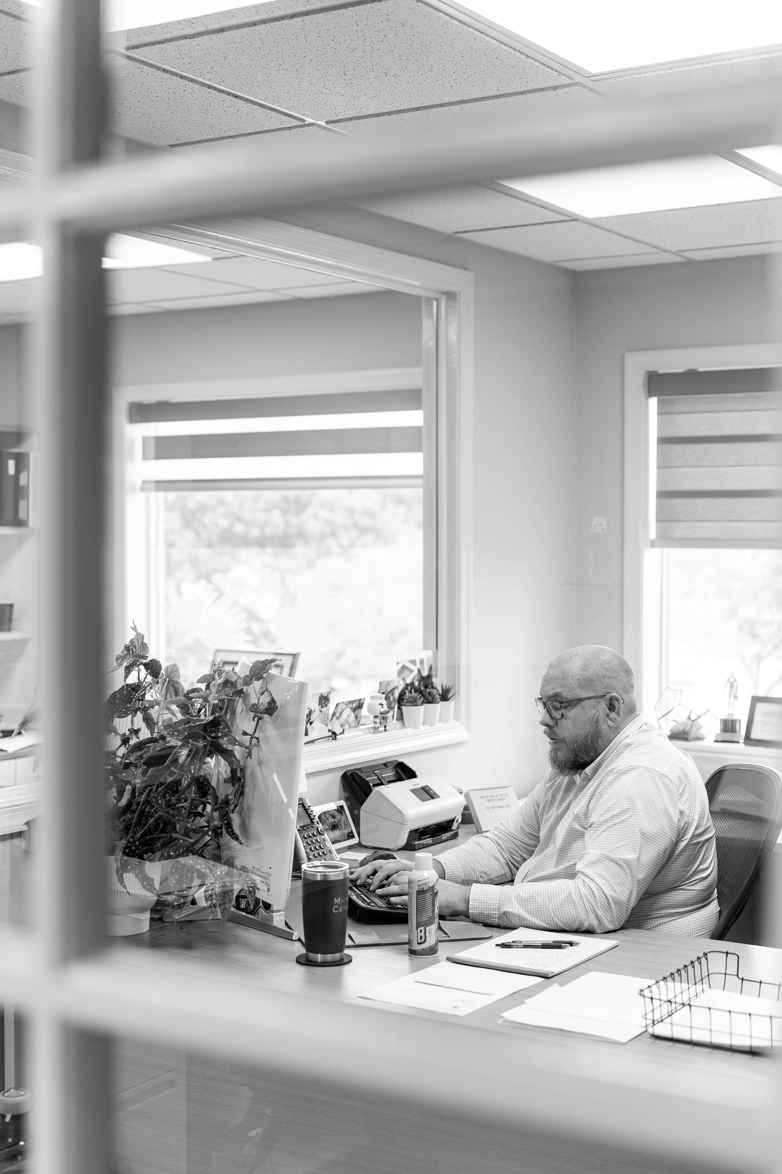 Neal Property Management team member analyzing property information at a desk