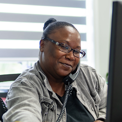 Neal Realty team member speaking with a client by phone