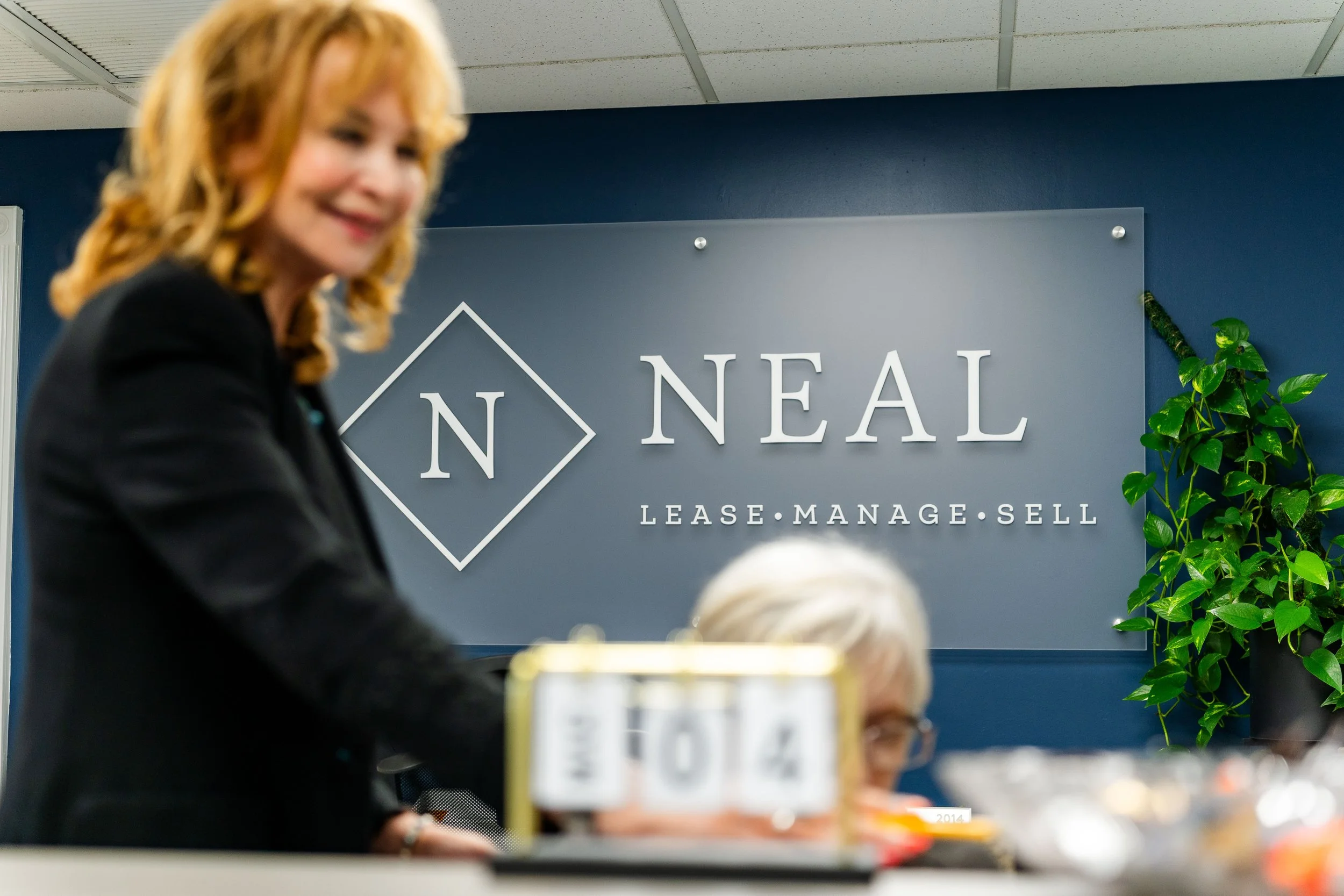 Neal Realty office with team members and company branding