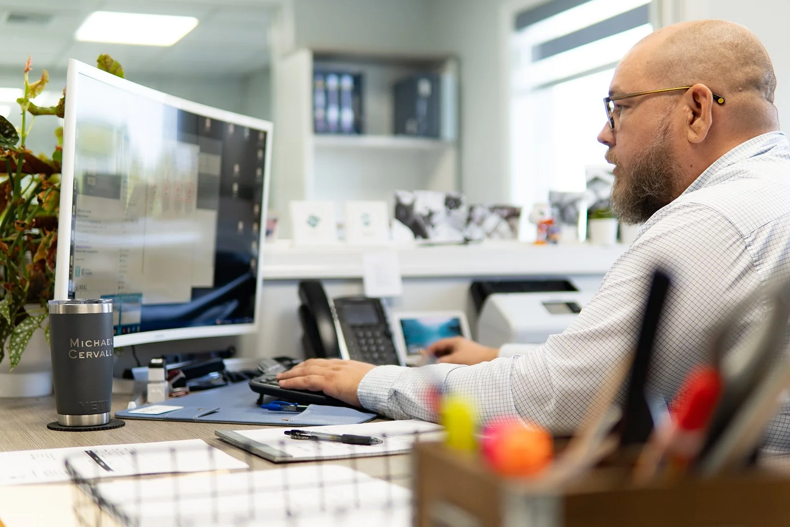 Neal Realty team member working at a computer in the office