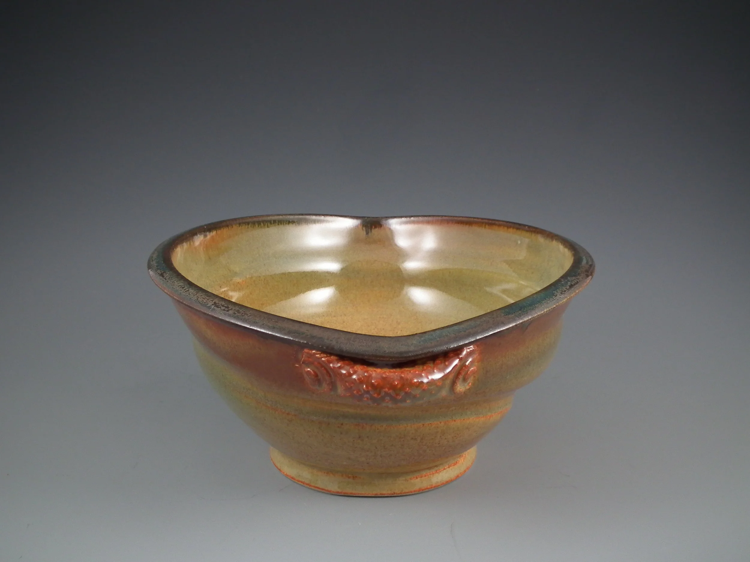  Altered serving bowl with textured handles, stoneware, layered glazes. 