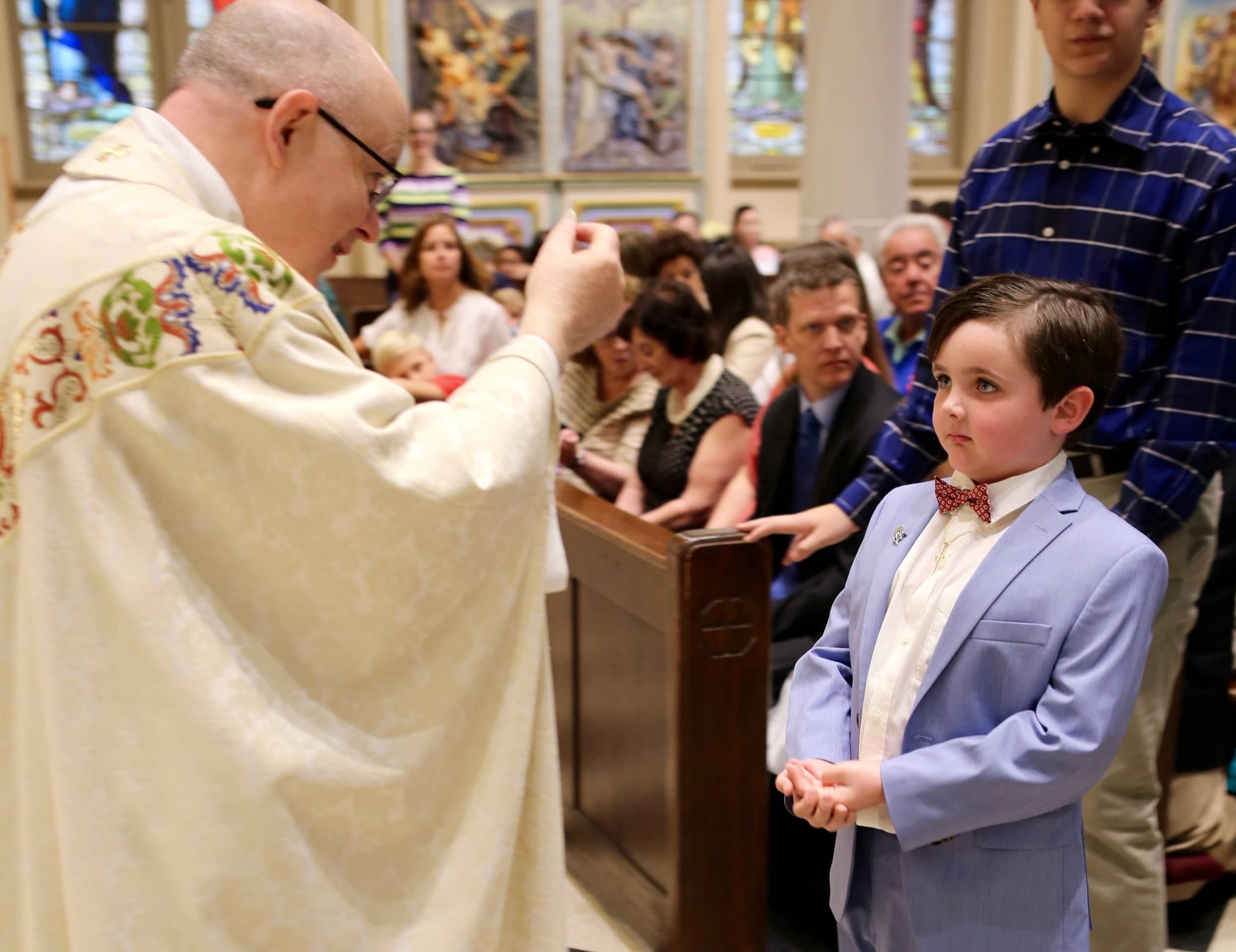 first-communion-boy-kid-suit-eucharist-st-francis-de-sales-church-new-york-city.jpg