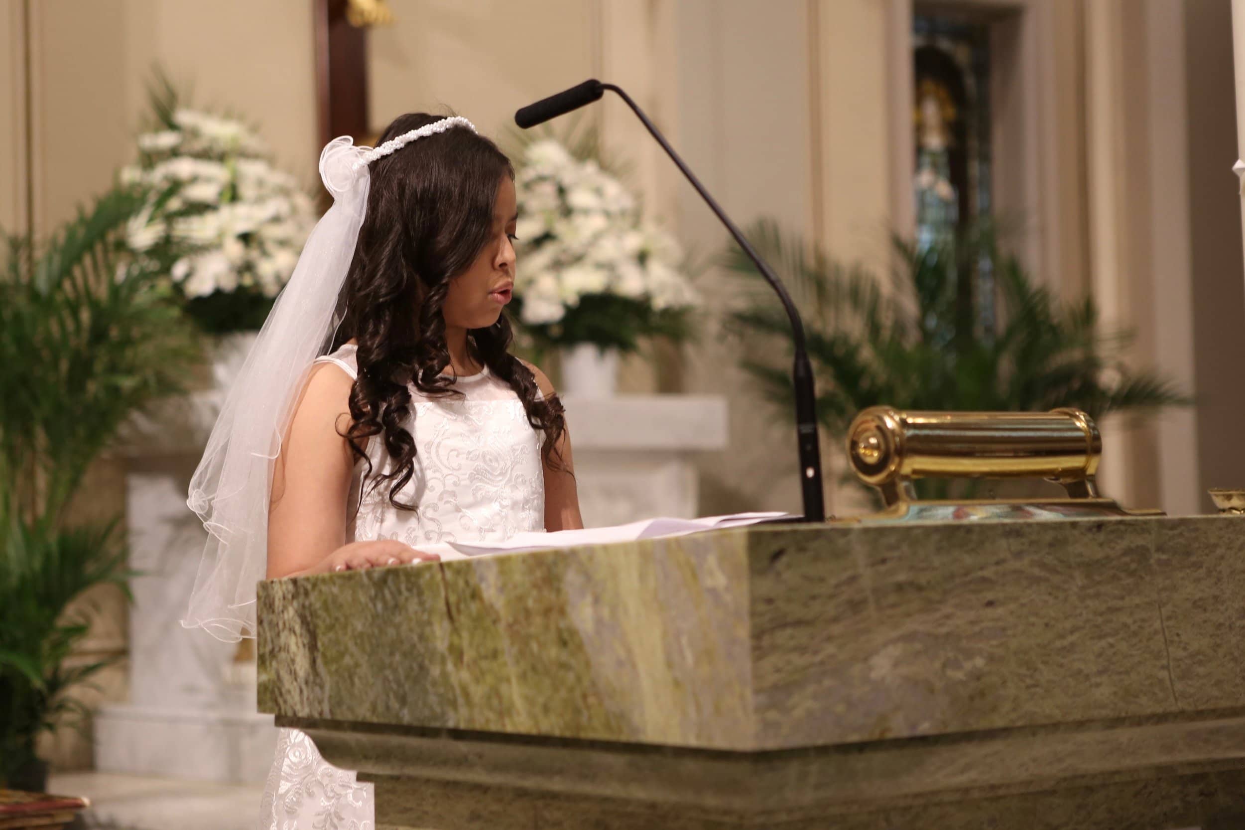 first-communion-sacrament-girl-white-dress-st-francis-de-sales-church-new-york-city.jpg