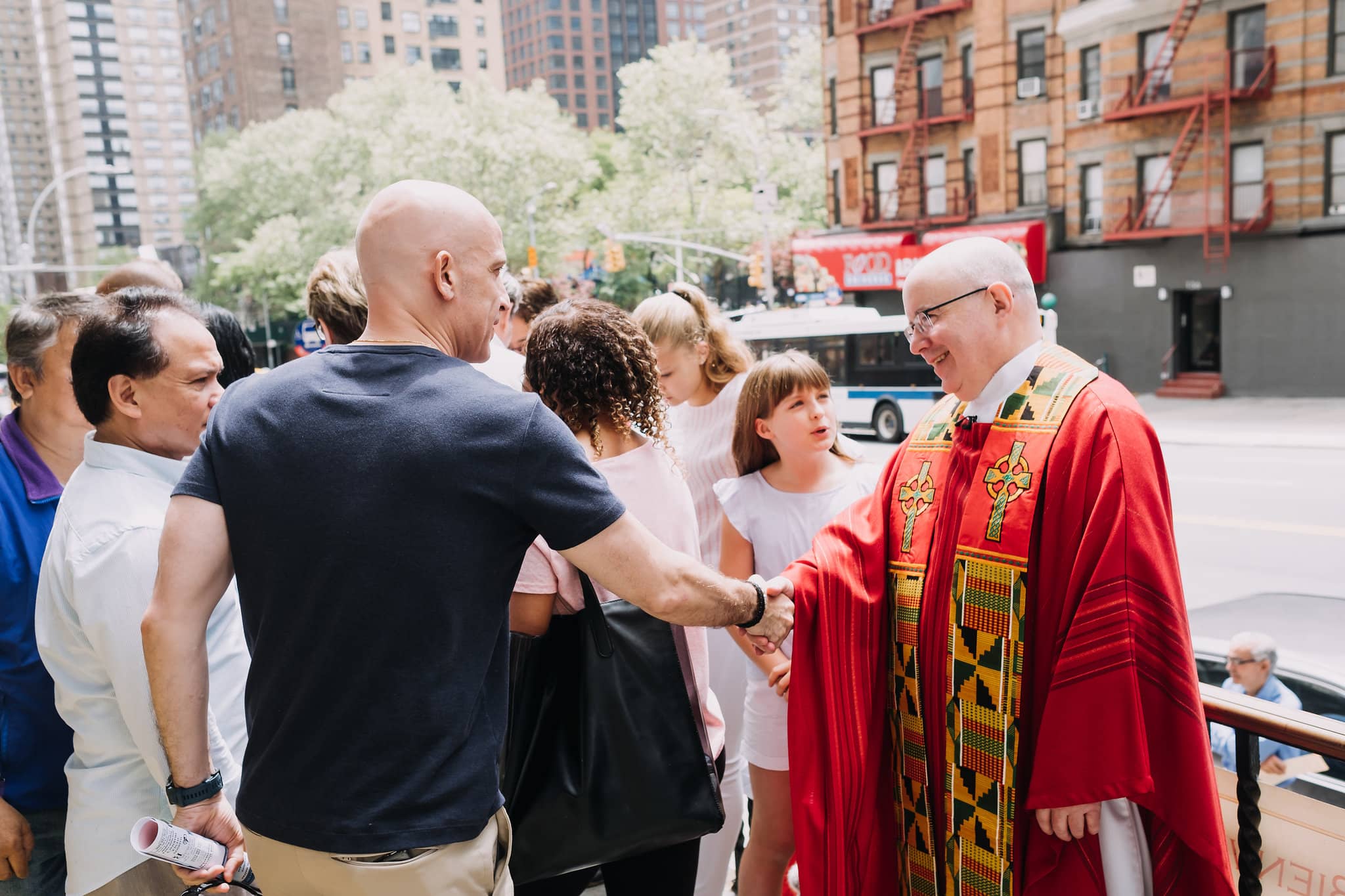 handshake-greeting-outside-mass-st-francis-de-sales-church-new-york-city.jpg